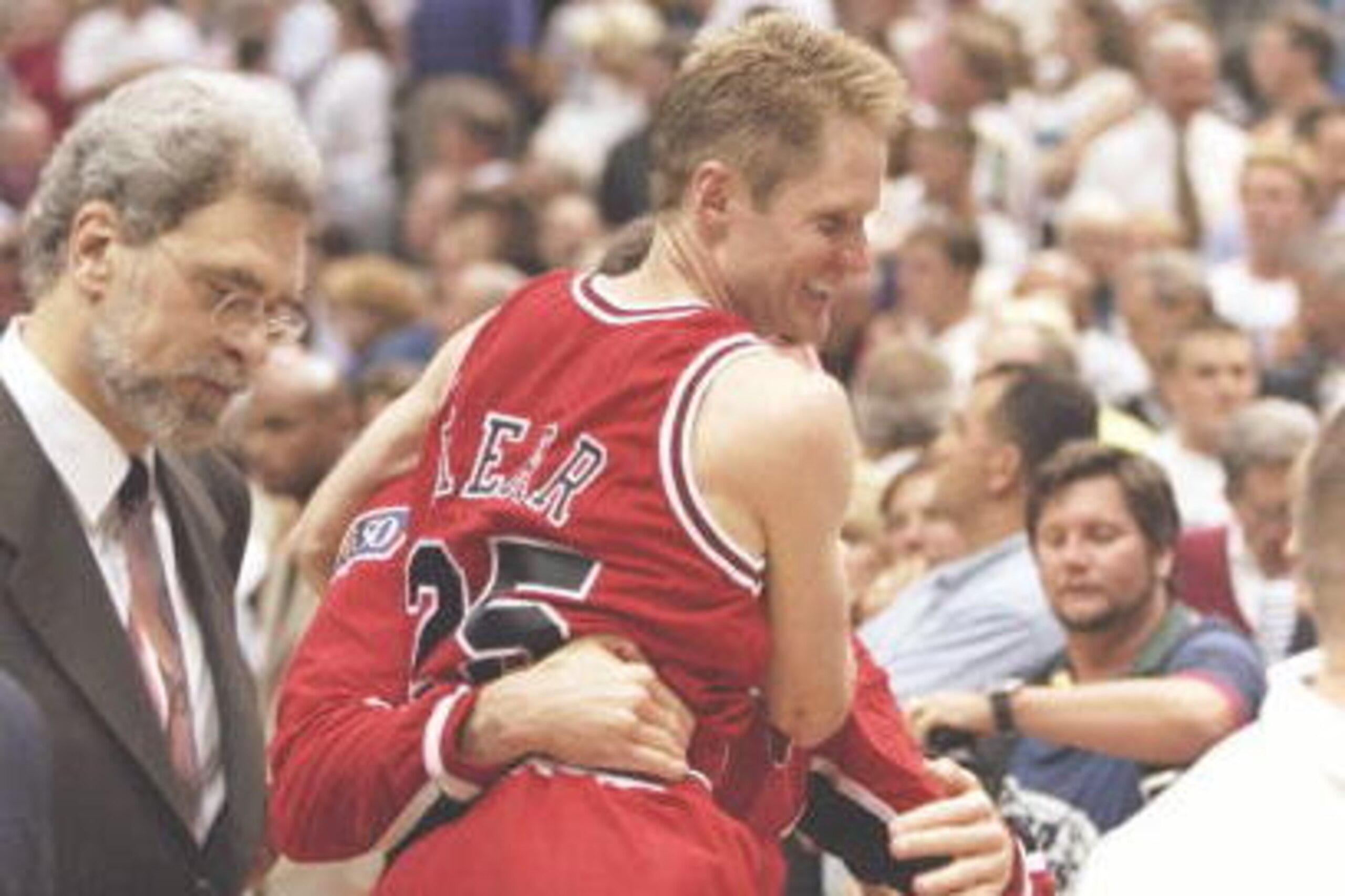 11 Jun 1997:  Guards Jud Buechler and Steve Kerr and coach Phil Jackson of the Chicago Bulls celebrate after a playoff game against the Utah Jazz at the Delta Center in Salt Lake City, Utah.  The Bulls won the game 90-88. Mandatory Credit: Brian Bahr  /Al