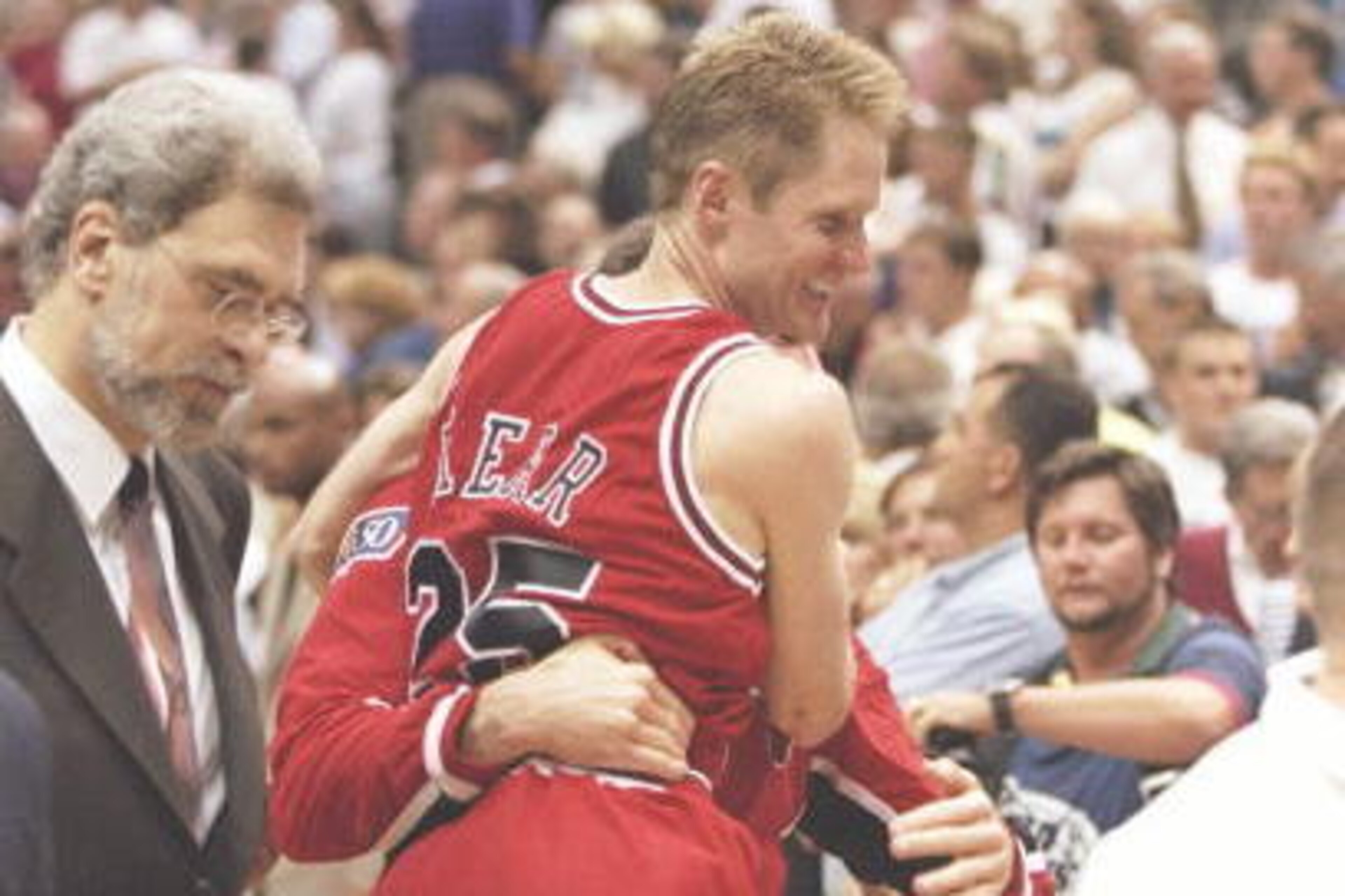 11 Jun 1997:  Guards Jud Buechler and Steve Kerr and coach Phil Jackson of the Chicago Bulls celebrate after a playoff game against the Utah Jazz at the Delta Center in Salt Lake City, Utah.  The Bulls won the game 90-88. Mandatory Credit: Brian Bahr  /Al