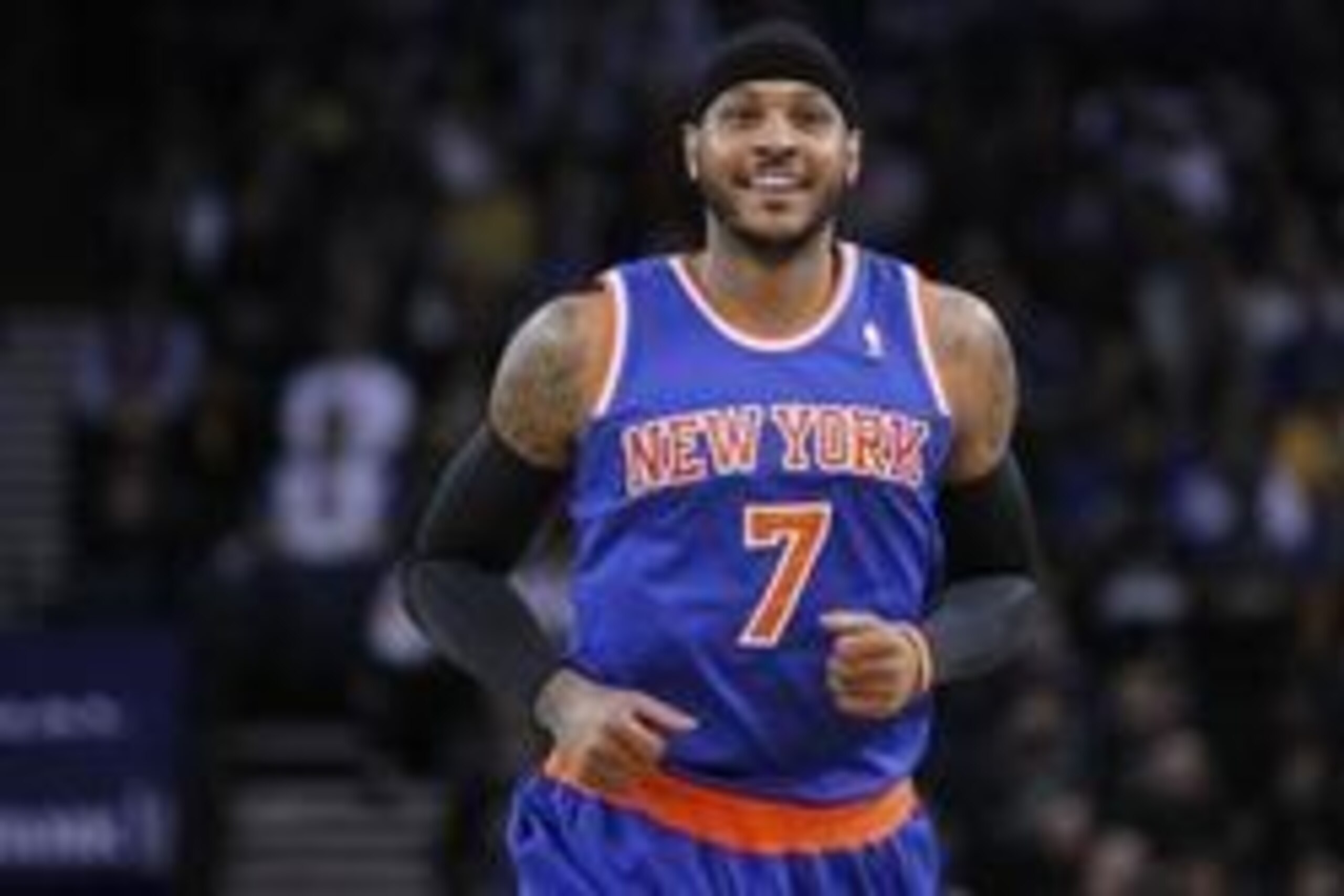 Mar 30, 2014; Oakland, CA, USA; New York Knicks forward Carmelo Anthony (7) smiles on the court against the Golden State Warriors in the first quarter at Oracle Arena. Mandatory Credit: Cary Edmondson-USA TODAY Sports