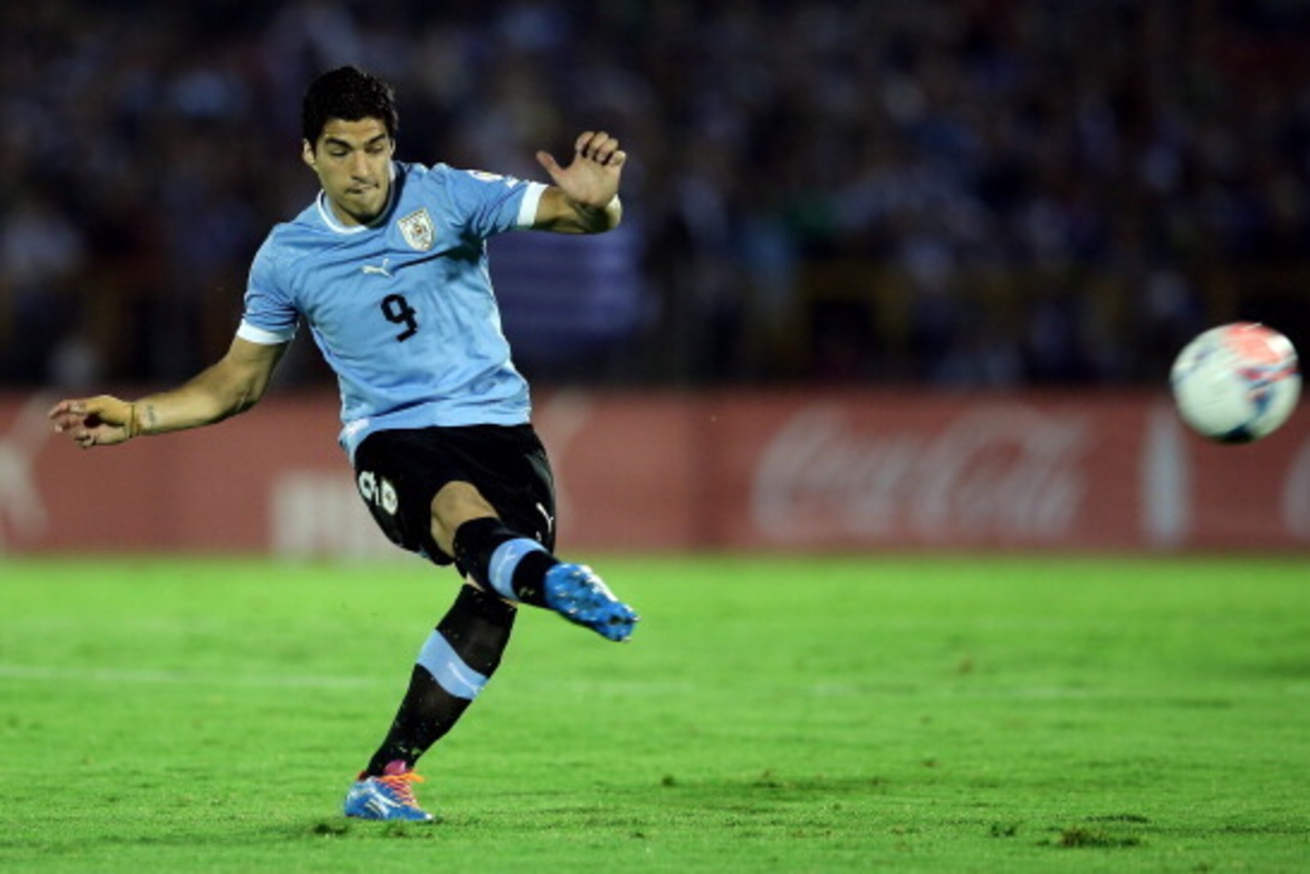 MONTEVIDEO, URUGUAY - NOVEMBER 20:  Luis Suarez of Uruguay runs with the ball during leg 2 of the FIFA World Cup Qualifier match between Uruguay and Jordan at Centenario Stadium Stadium on November 20, 2013 in Montevideo, Uruguay.  (Photo by Friedemann Vo