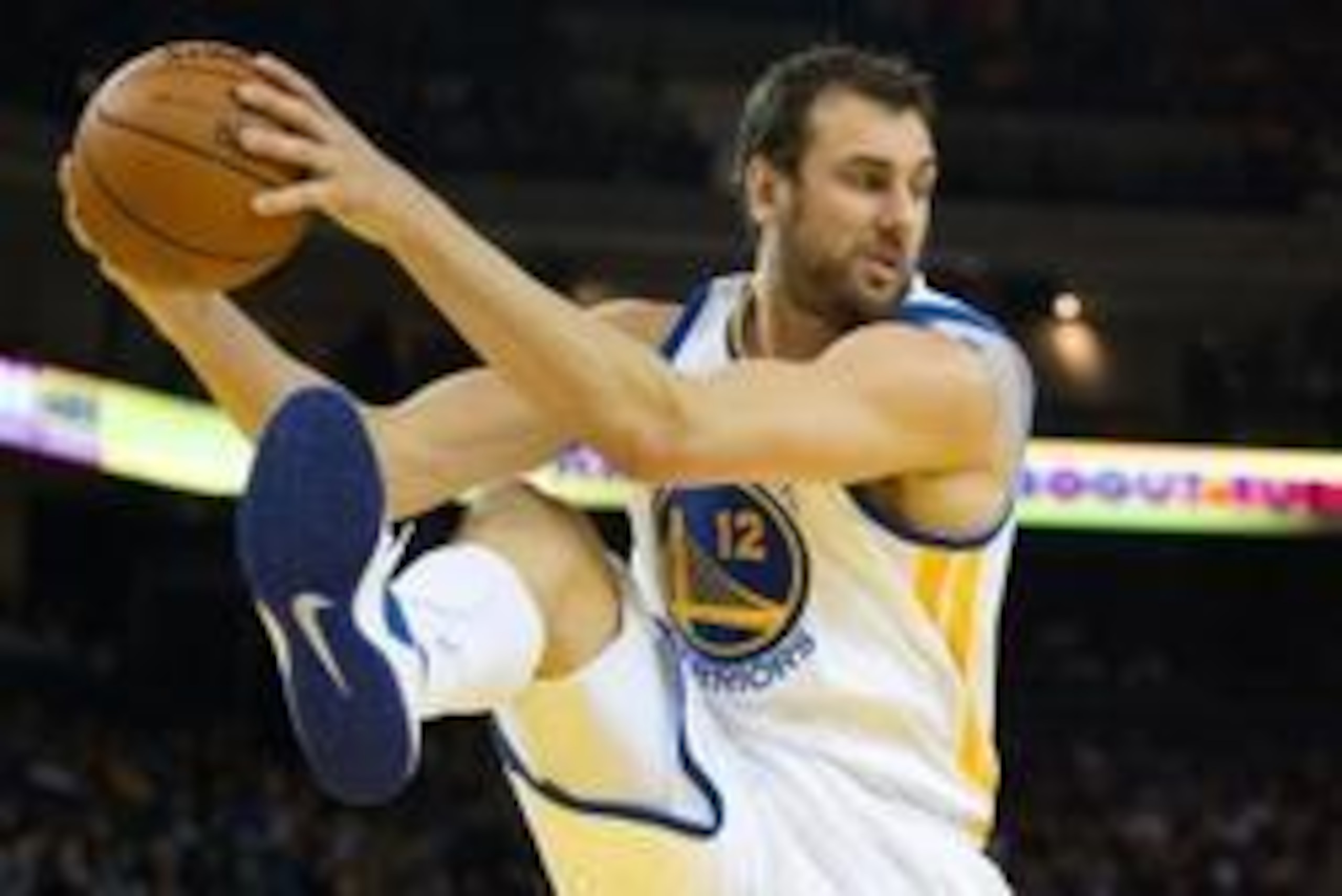 Mar 14, 2014; Oakland, CA, USA; Golden State Warriors center Andrew Bogut (12) controls a rebound against the Cleveland Cavaliers during the second quarter at Oracle Arena. Mandatory Credit: Kelley L Cox-USA TODAY Sports