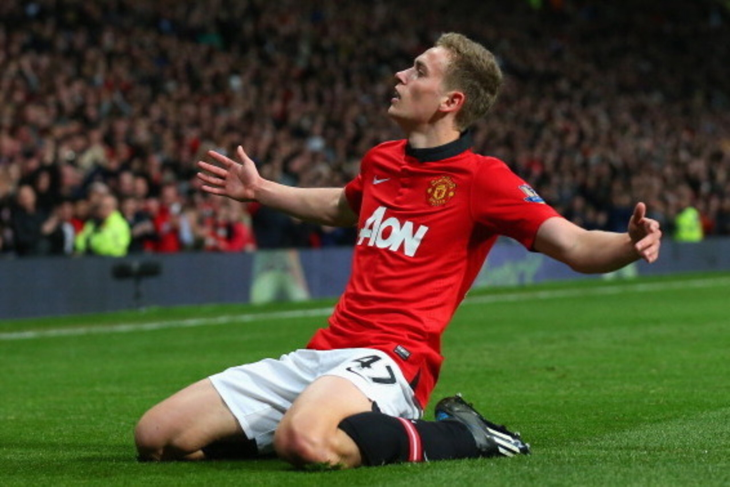 MANCHESTER, ENGLAND - MAY 06:  James Wilson of Manchester United celebrates scoring the second goal during the Barclays Premier League match between Manchester United and Hull City at Old Trafford on May 6, 2014 in Manchester, England.  (Photo by Alex Liv