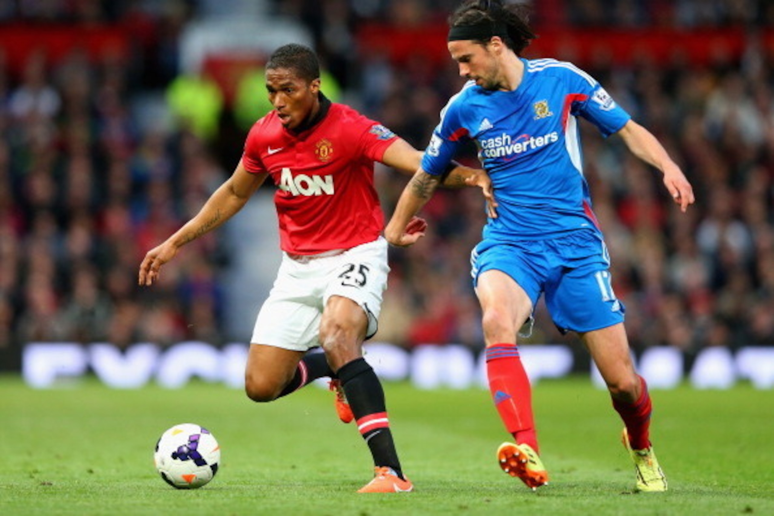 MANCHESTER, ENGLAND - MAY 06:  Luis Antonio Valencia of Manchester United competes with George Boyd of Hull City during the Barclays Premier League match between Manchester United and Hull City at Old Trafford on May 6, 2014 in Manchester, England.  (Phot