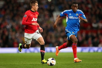 MANCHESTER, ENGLAND - MAY 06:  Adnan Januzaj of Manchester United competes with Maynor Figueroa of Hull City during the Barclays Premier League match between Manchester United and Hull City at Old Trafford on May 6, 2014 in Manchester, England.  (Photo by