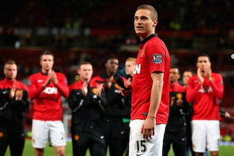 MANCHESTER, ENGLAND - MAY 06:  Nemanja Vidic of Manchester United speaks to the fans after his final home game for the club at the end of the Barclays Premier League match between Manchester United and Hull City at Old Trafford on May 6, 2014 in Mancheste