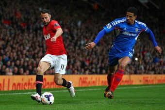 MANCHESTER, ENGLAND - MAY 06:  Manchester United Caretaker Manager Ryan Giggs competes with Curtis Davies of Hull City during the Barclays Premier League match between Manchester United and Hull City at Old Trafford on May 6, 2014 in Manchester, England. 