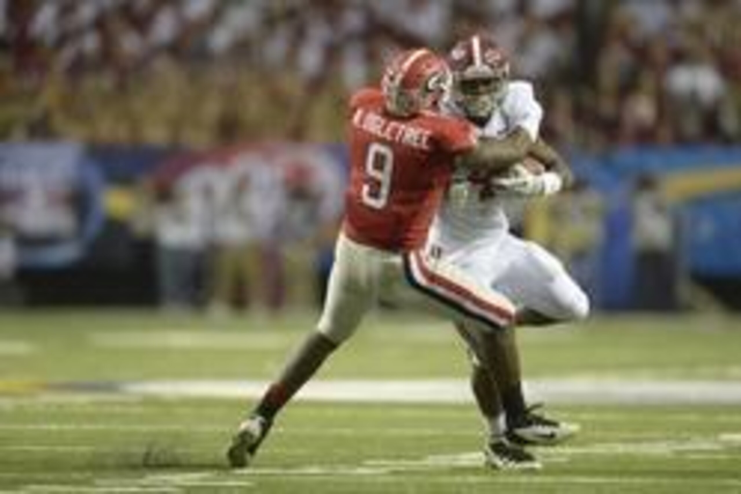 Dec 1, 2012; Atlanta, GA, USA; Georgia Bulldogs linebacker Alec Ogletree (9) tackles Alabama Crimson Tide running back T.J. Yeldon (4) during the third quarter of the 2012 SEC Championship game at the Georgia Dome.  Mandatory Credit: Paul Abell-USA TODAY 