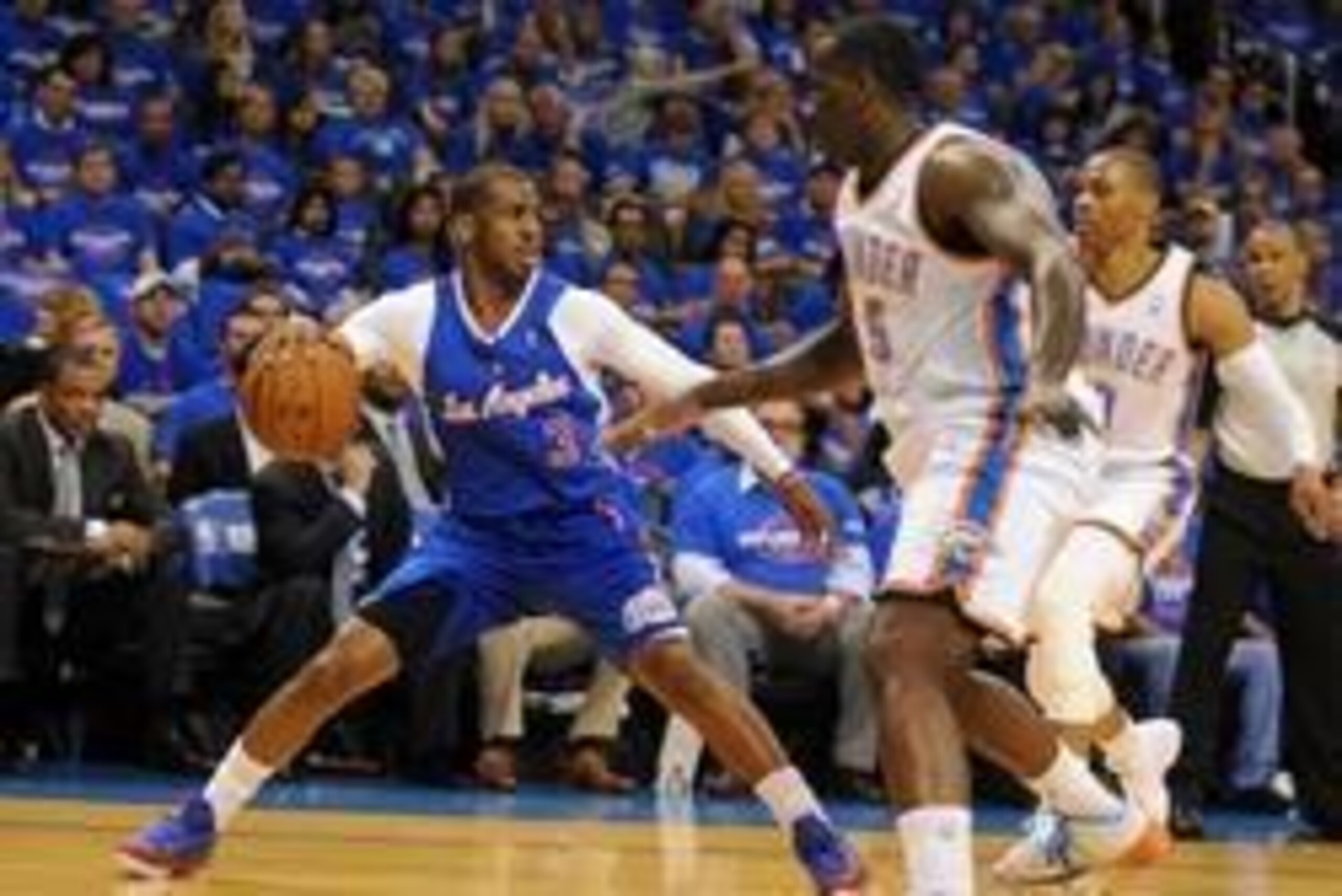 May 5, 2014; Oklahoma City, OK, USA; Los Angeles Clippers guard Chris Paul (3) handles the ball against Oklahoma City Thunder center Kendrick Perkins (5) during the first quarter in game one of the second round of the 2014 NBA Playoffs at Chesapeake Energ