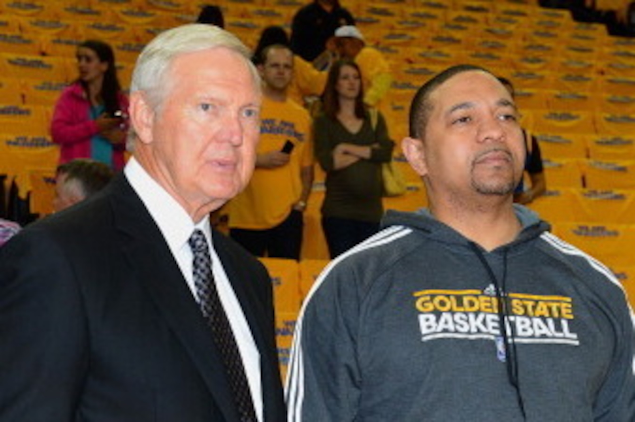 OAKLAND, CA - MAY 10: Executive Board member Jerry West and Head Coach Mark Jackson of the Golden State Warriors chat prior to the game against the San Antonio Spurs in Game Three of the Western Conference Semifinals during the 2013 NBA Playoffs on May 10