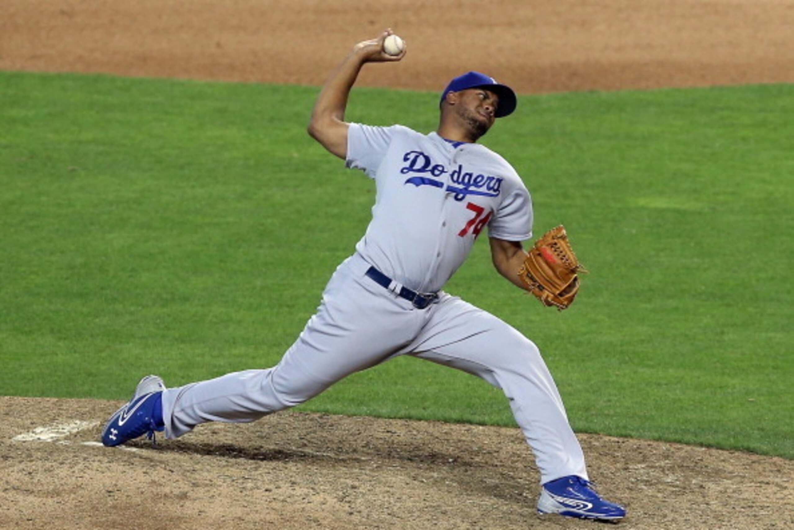PHOENIX, AZ - APRIL 13:  Relief pitcher Kenley Jansen #74 of the Los Angeles Dodgers pitches against the Arizona Diamondbacks during the MLB game at Chase Field on April 13, 2014 in Phoenix, Arizona. The Dodgers defeated the Diamondbacks 8-6.  (Photo by C