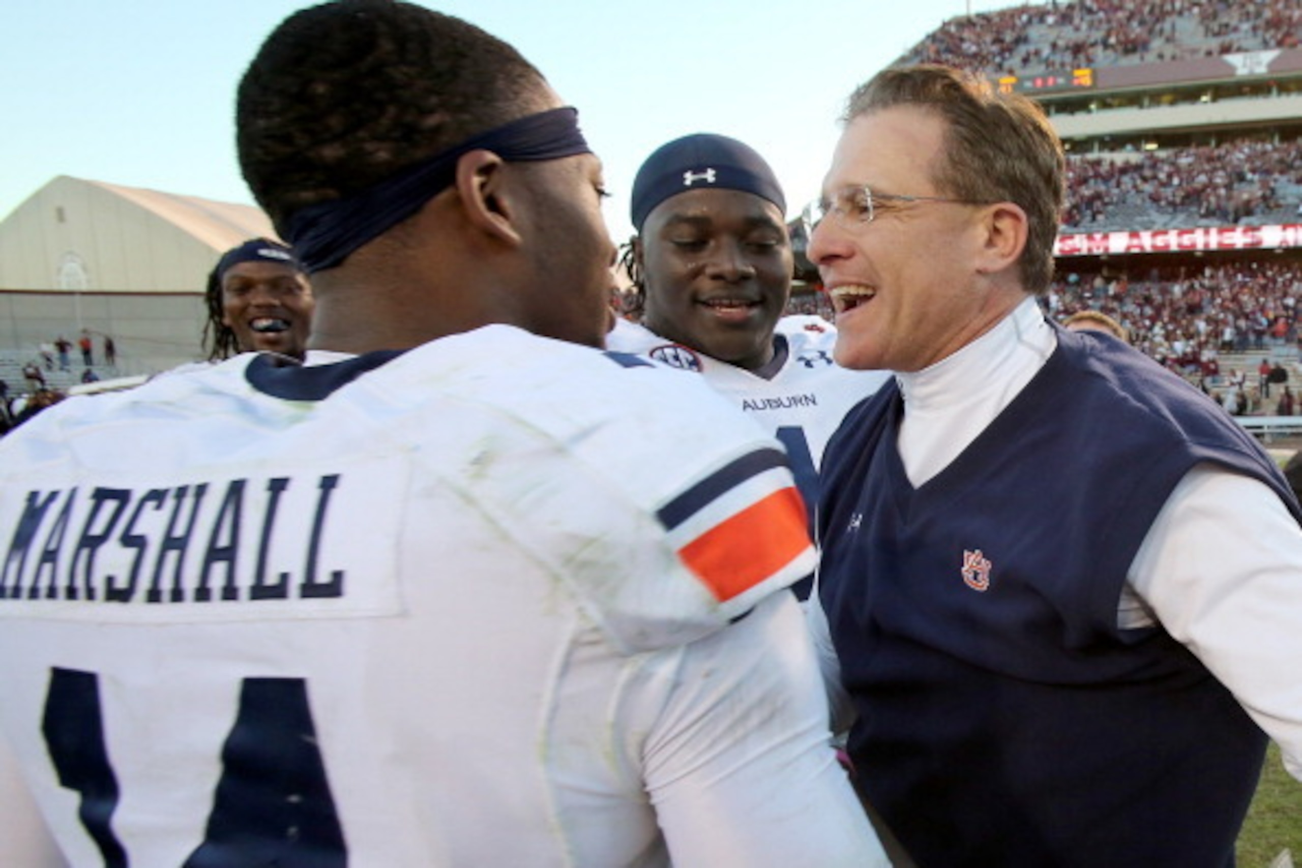 HOUSTON, TX - OCTOBER 19: Nick Marshall #14 of the Auburn Tigers hugs head coach Gus Malzahn of the Auburn Tigers after they defeated the Texas A&M Aggies on October 19, 2013 at Kyle Field in College Station, Texas. Auburn Tigers won 45 to 41.(Photo by Th