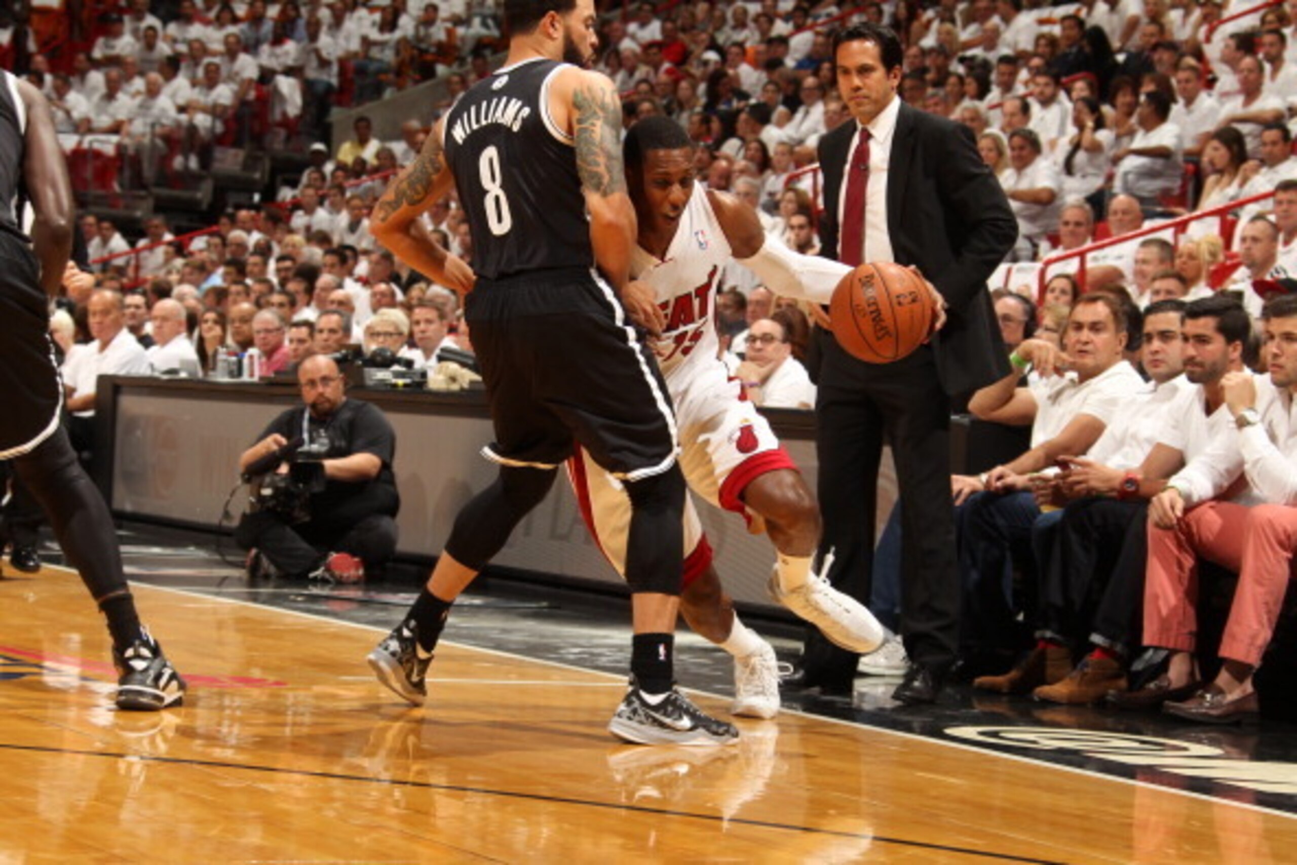 MIAMI, FL - MAY 6: Mario Chalmers #15 of the Miami Heat drives against the Brooklyn Nets in Game One of the Eastern Conference Semi-Finals during the 2014 NBA Playoffs at American Airlines Arena on May 6, 2014 in Miami, Florida. NOTE TO USER: User express MIAMI, FL - MAY 6: Mario Chalmers #15 of the Miami Heat drives against the Brooklyn Nets in Game One of the Eastern Conference Semi-Finals during the 2014 NBA Playoffs at American Airlines Arena on May 6, 2014 in Miami, Florida. NOTE TO USER: User express