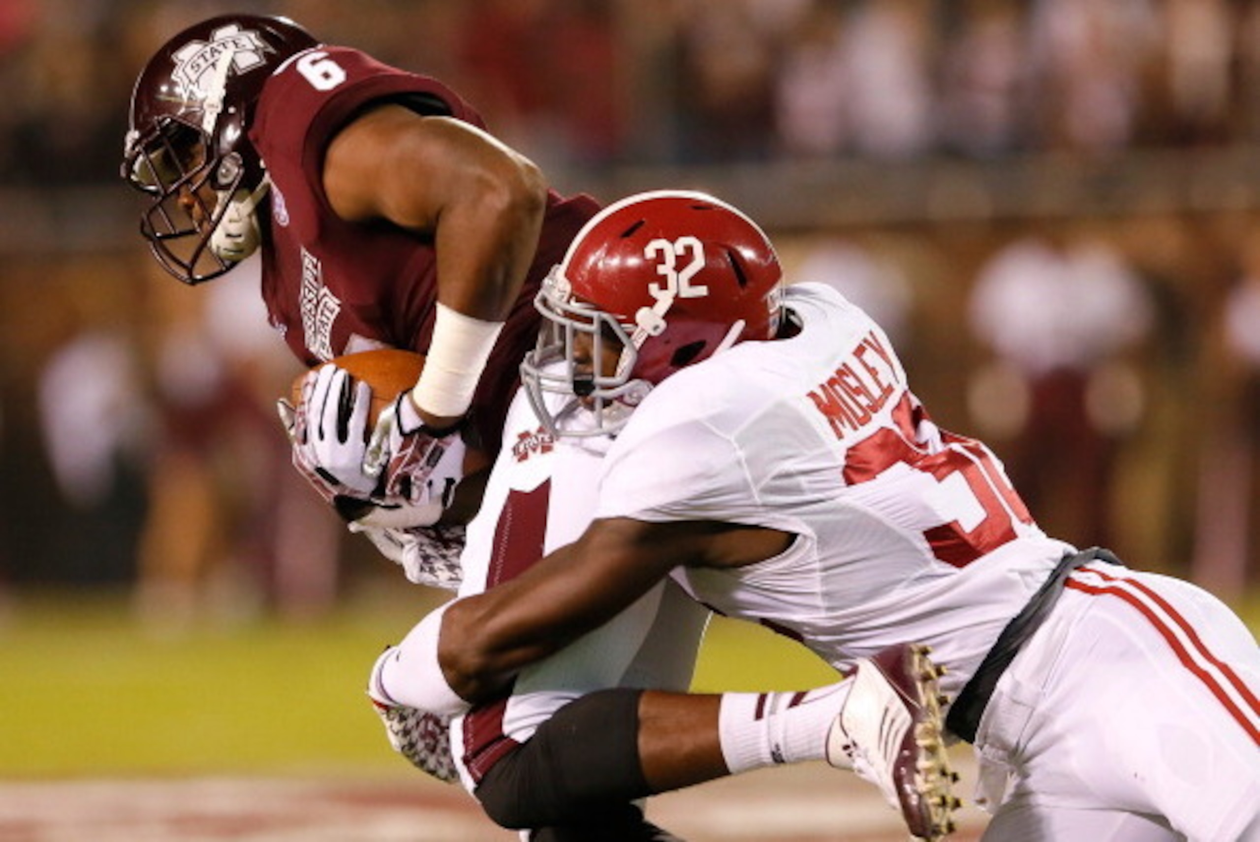 STARKVILLE, MS - NOVEMBER 16:  Malcolm Johnson #6 of the Mississippi State Bulldogs pulls in this reception against C.J. Mosley #32 of the Alabama Crimson Tide at Davis Wade Stadium on November 16, 2013 in Starkville, Mississippi.  (Photo by Kevin C. Cox/