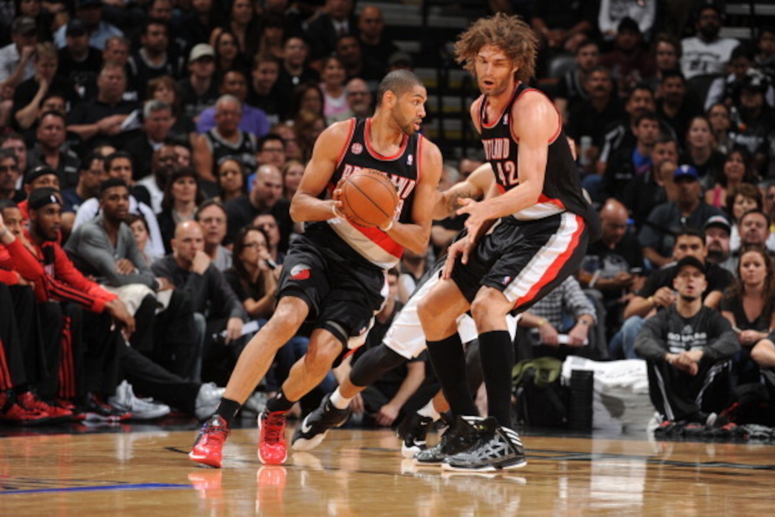 SAN ANTONIO, TX - MAY 6: Nicolas Batum #88 of the Portland Trail Blazers handles the ball against the San Antonio Spurs in Game One of the Western Conference Semi-Finals during the 2014 NBA Playoffs at AT&T Center on May 6, 2014 in San Antonio, Texas. NOT