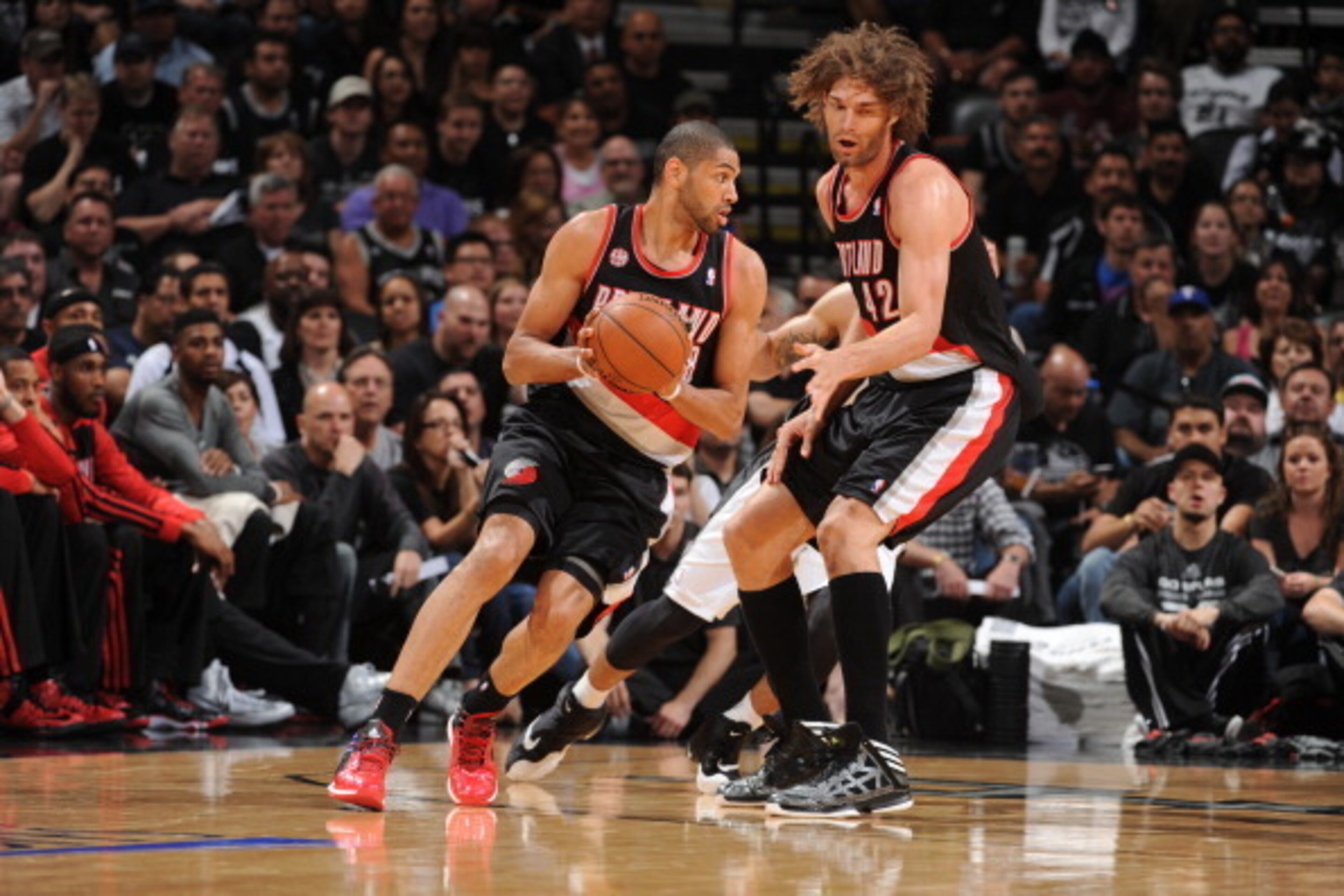 SAN ANTONIO, TX - MAY 6: Nicolas Batum #88 of the Portland Trail Blazers handles the ball against the San Antonio Spurs in Game One of the Western Conference Semi-Finals during the 2014 NBA Playoffs at AT&T Center on May 6, 2014 in San Antonio, Texas. NOT