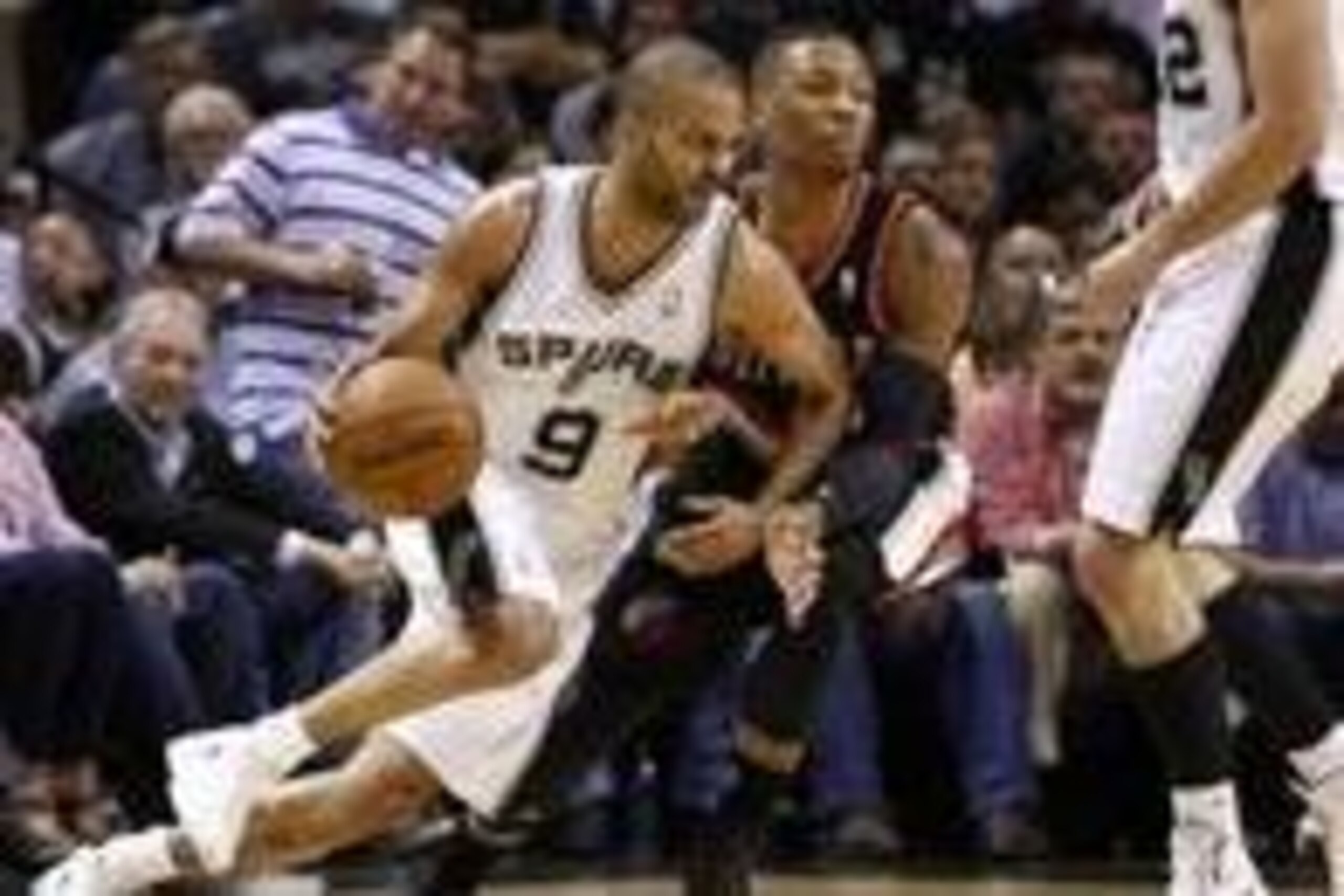 May 6, 2014; San Antonio, TX, USA; San Antonio Spurs guard Tony Parker (9) moves the ball against the defense of Portland Trail Blazers guard Damian Lillard (0) in game one of the second round of the 2014 NBA Playoffs at AT&T Center. Mandatory Credit: Soo May 6, 2014; San Antonio, TX, USA; San Antonio Spurs guard Tony Parker (9) moves the ball against the defense of Portland Trail Blazers guard Damian Lillard (0) in game one of the second round of the 2014 NBA Playoffs at AT&T Center. Mandatory Credit: Soo