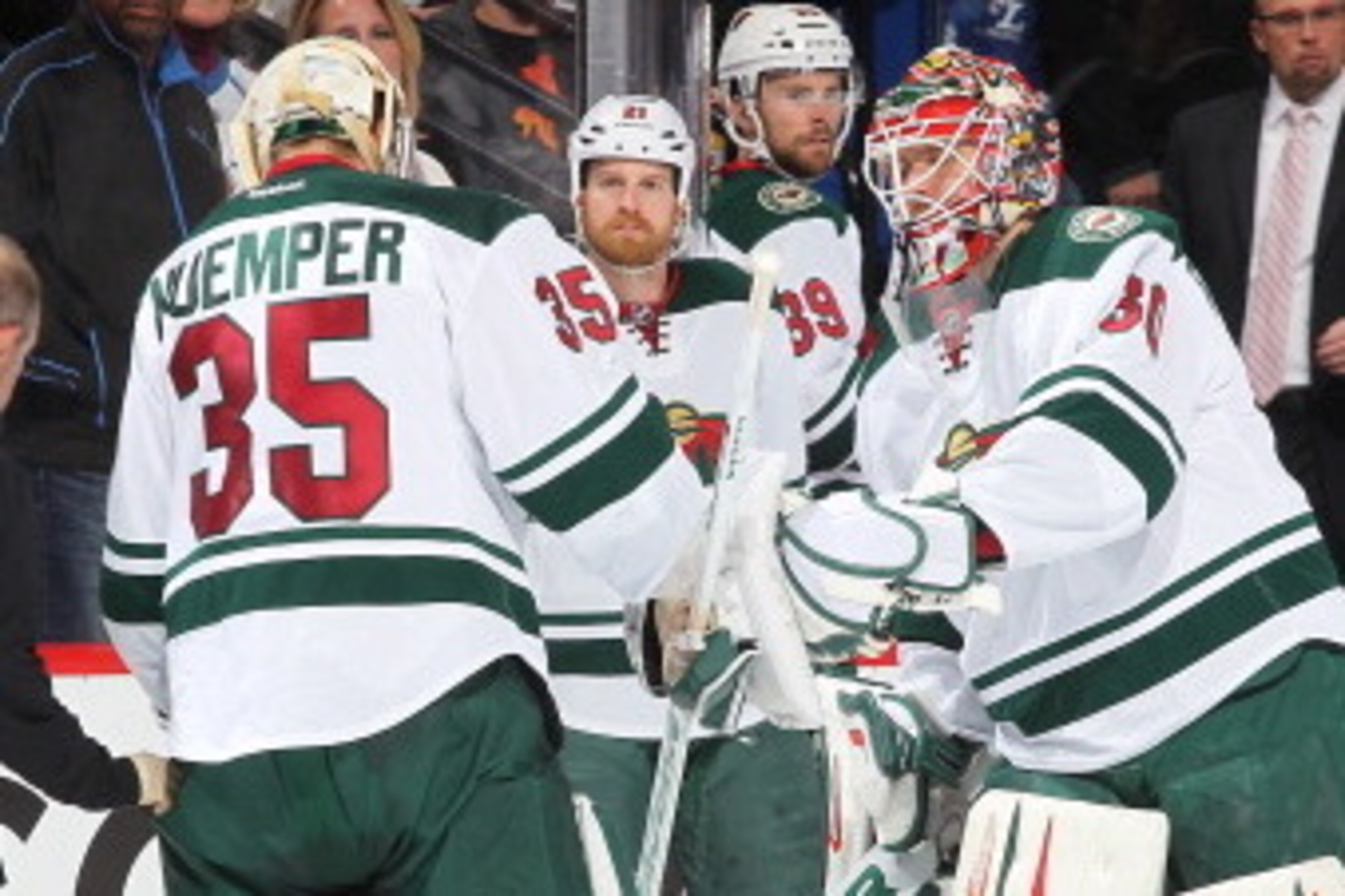 DENVER, CO - APRIL 30: Goaltender Darcy Kuemper #35 of the Minnesota Wild skates off the ice in the third period as he is replaced by goaltender Ilya Bryzgalov #30 during Game Seven of the First Round of the 2014 Stanley Cup Playoffs against the Colorado 