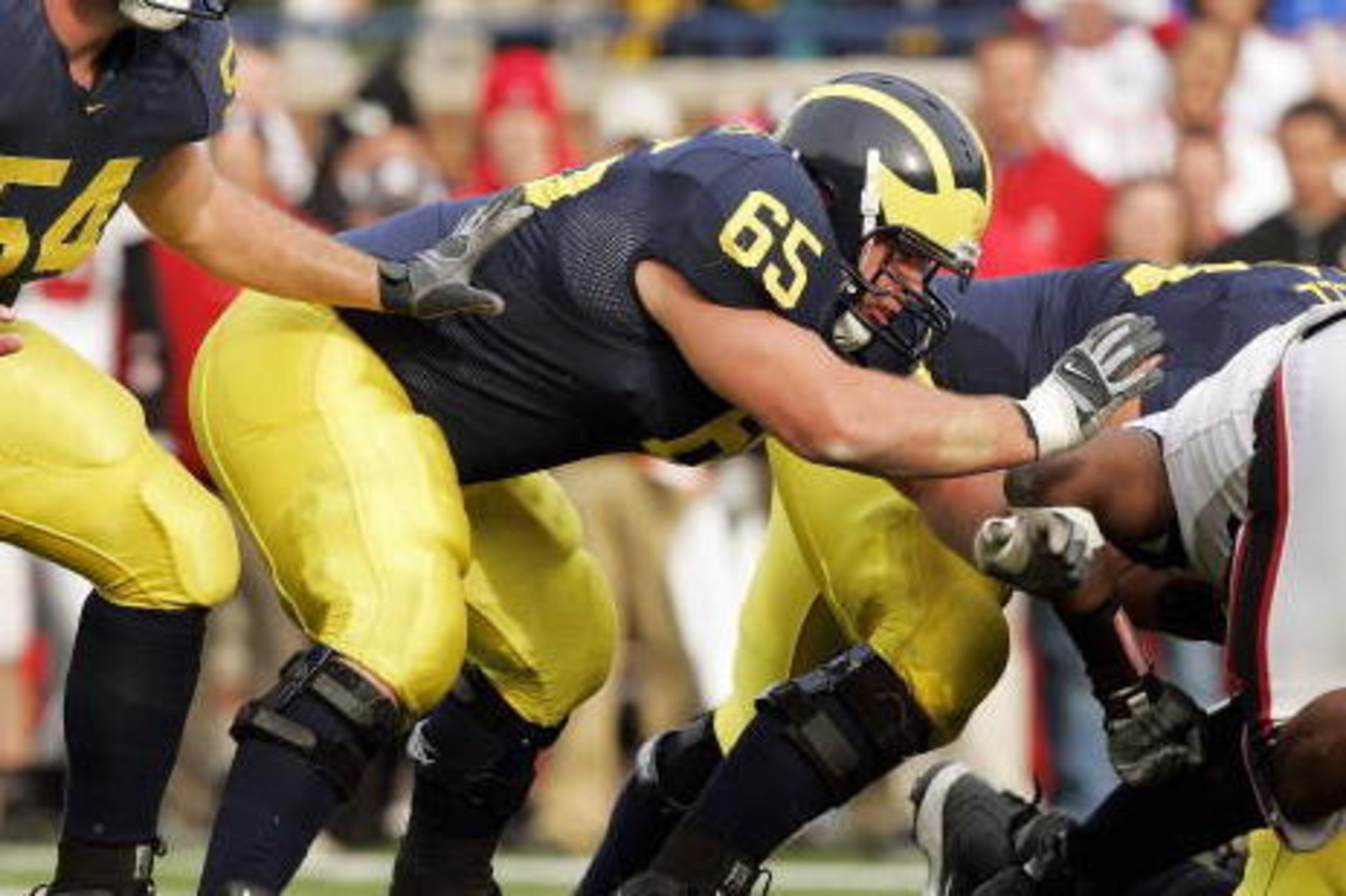 ANN ARBOR, MI - NOVEMBER 4: Center Mark Bihl #54 and offensive linebacker Justin Boren #65 of the Michigan Wolverines during the NCAA game against the Ball State Cardinals on November 4, 2006 at Michigan Stadium in Ann Arbor, Michigan. Michigan won 34-26 ANN ARBOR, MI - NOVEMBER 4: Center Mark Bihl #54 and offensive linebacker Justin Boren #65 of the Michigan Wolverines during the NCAA game against the Ball State Cardinals on November 4, 2006 at Michigan Stadium in Ann Arbor, Michigan. Michigan won 34-26