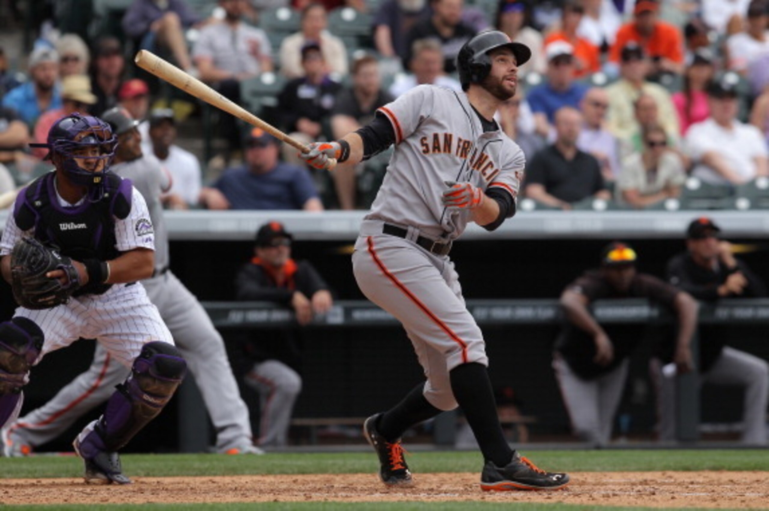 DENVER, CO - APRIL 23:  Brandon Belt #9 of the San Francisco Giants takes an at bat against the Colorado Rockies at Coors Field on April 23, 2014 in Denver, Colorado. The Giants defeated the Rockies 12-10 in 11 innings.  (Photo by Doug Pensinger/Getty Ima