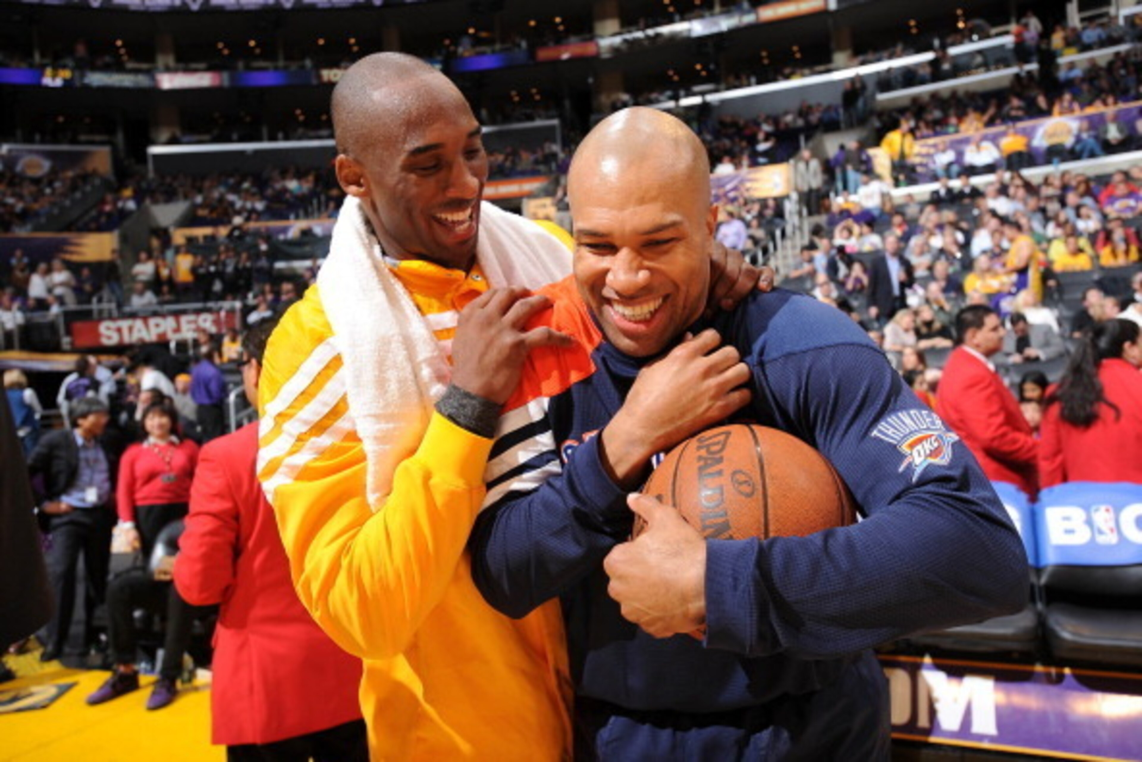 LOS ANGELES, CA - MARCH 29:  Derek Fisher #37 of the Oklahoma City Thunder is greeted by Kobe Bryant #24 of the Los Angeles Lakers at Staples Center on March 29, 2012 in Los Angeles, California. NOTE TO USER: User expressly acknowledges and agrees that, b