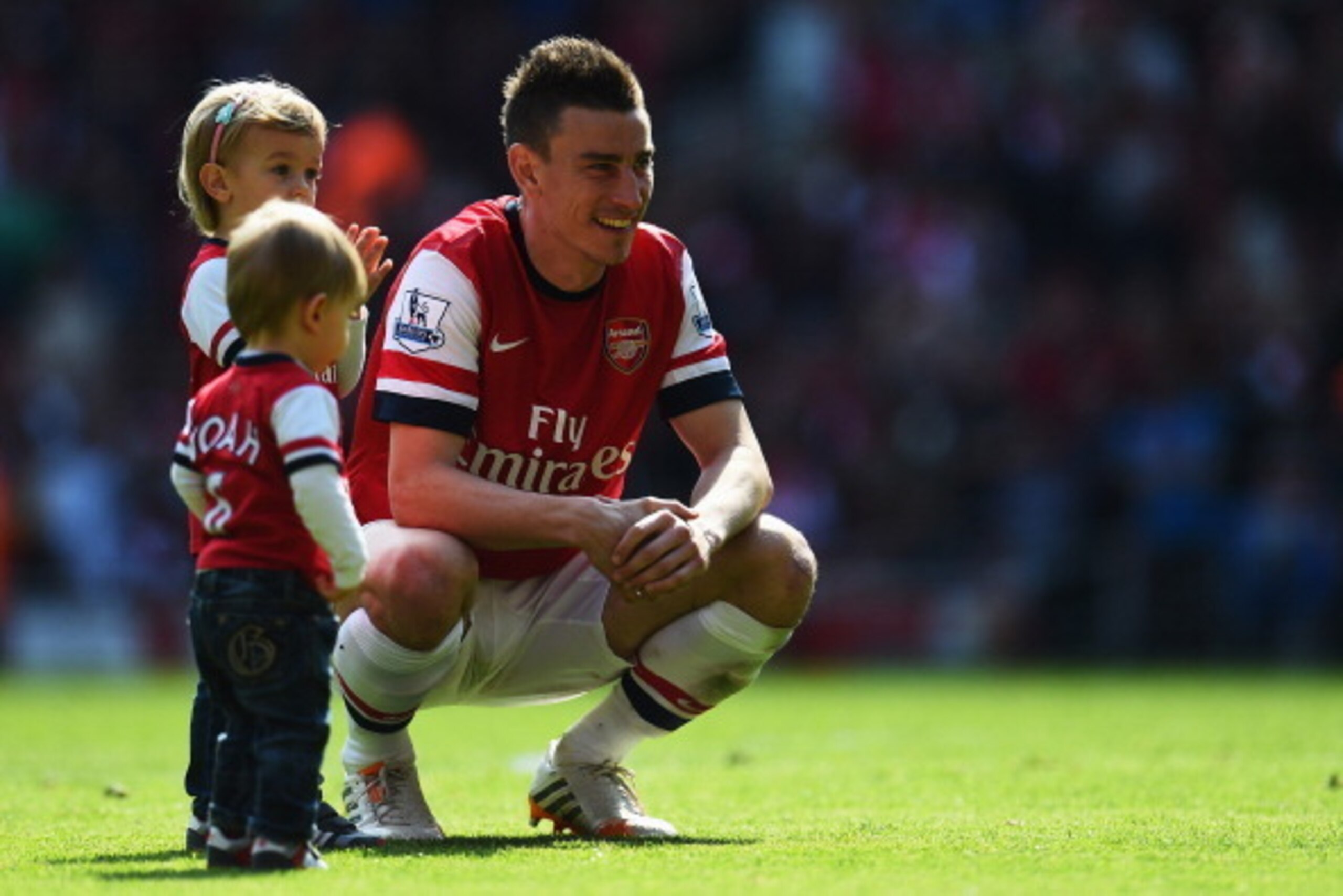 LONDON, ENGLAND - MAY 04:  Laurent Koscielny of Arsenal and his family are seen on the pitch following the Barclays Premier League match between Arsenal and West Bromwich Albion at the Emirates Stadium on May 4, 2014 in London, England.  (Photo by Shaun B