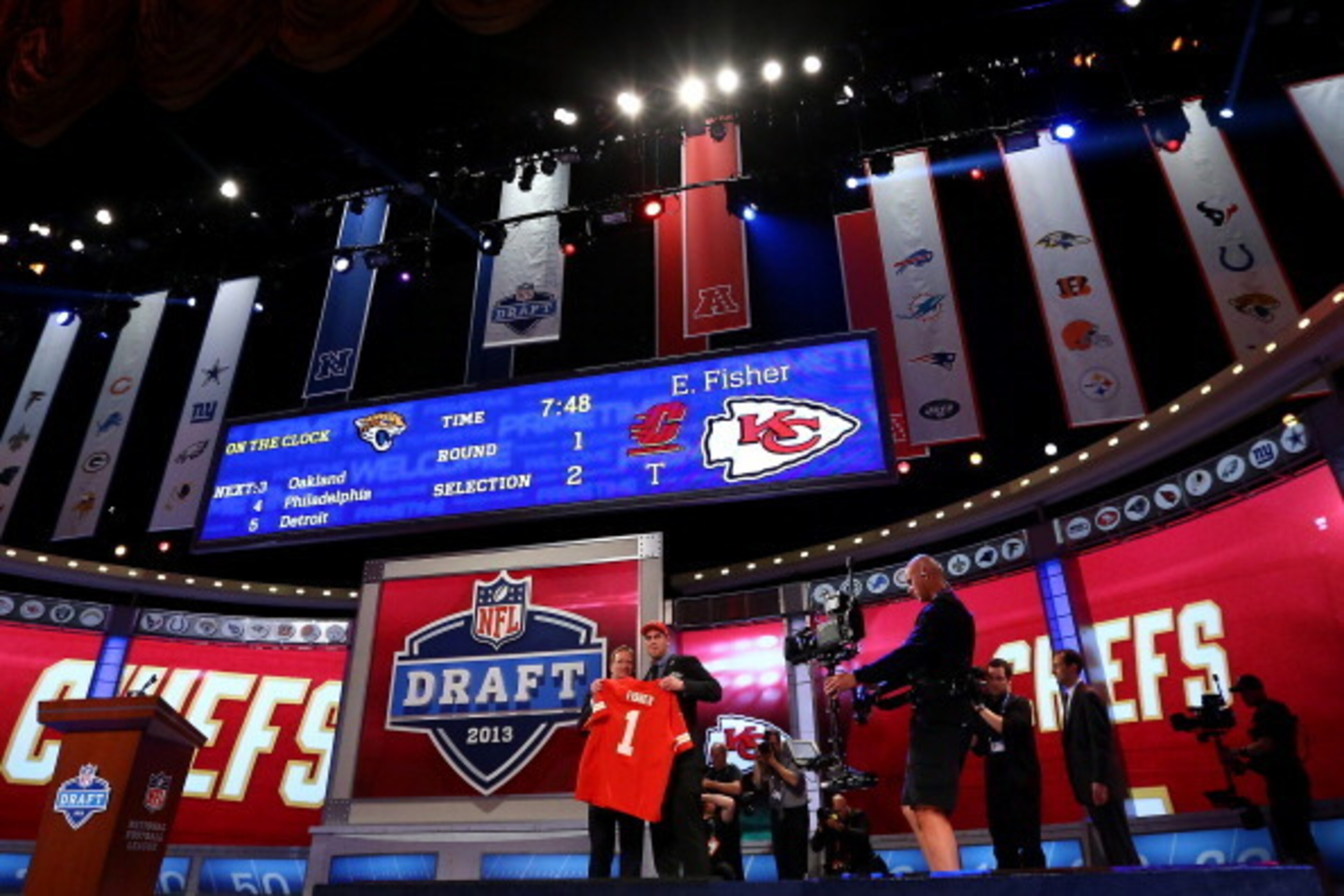 NEW YORK, NY - APRIL 25:  Eric Fisher (R) of Central Michigan Chippewas stands on stage with NFL COmmissioner Roger Goodell after Fisher was picked #1 overall by the Kansas City Chiefs in the first round of the 2013 NFL Draft at Radio City Music Hall on A