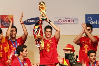 MADRID, SPAIN - JULY 12: Fernando Torres of the Spanish national football team holds up the trophy during the Spanish team's victory parade following their win in the 2010 FIFA World Cup on July 12, 2010 in Madrid, Spain. (Photo by Daniel Sastre/Getty Ima