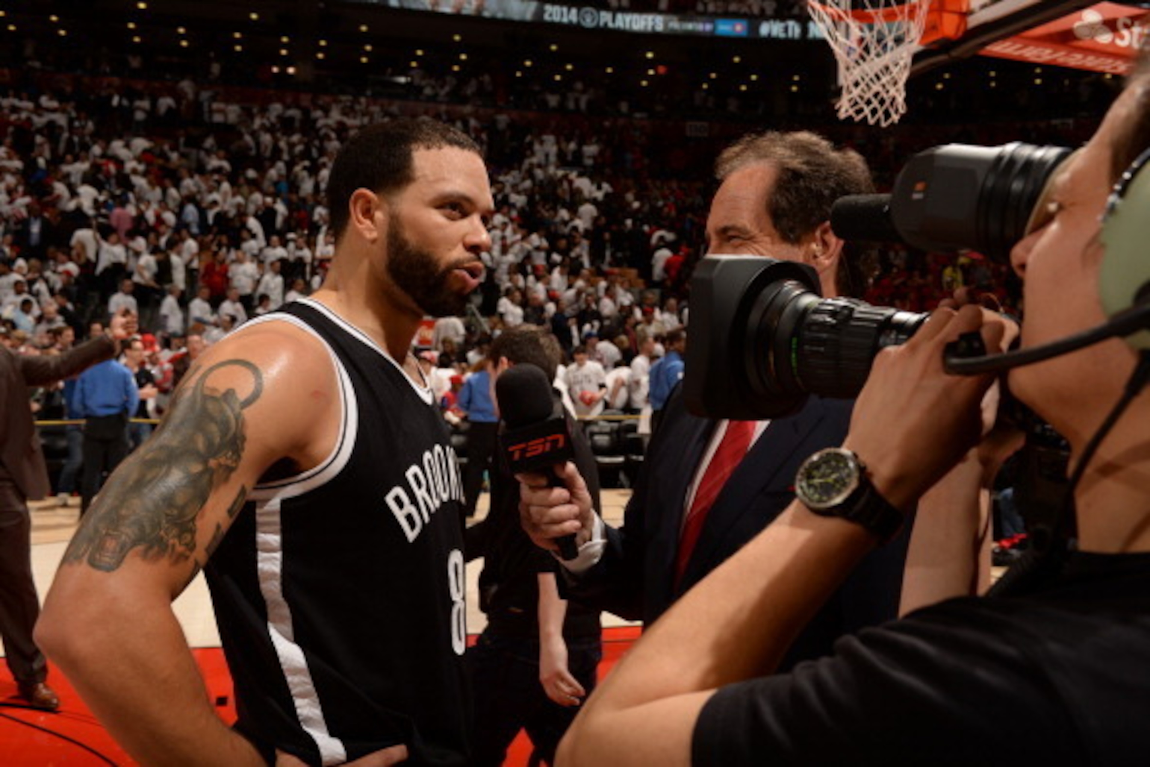 TORONTO, ON - MAY 4: Deron Williams #8 of the Brooklyn Nets speaks to the media after a game against the Toronto Raptors in Game Seven of the Eastern Conference Quarterfinals during the NBA Playoffs at the Air Canada Centre on May 4, 2014 in Toronto, Onta TORONTO, ON - MAY 4: Deron Williams #8 of the Brooklyn Nets speaks to the media after a game against the Toronto Raptors in Game Seven of the Eastern Conference Quarterfinals during the NBA Playoffs at the Air Canada Centre on May 4, 2014 in Toronto, Onta