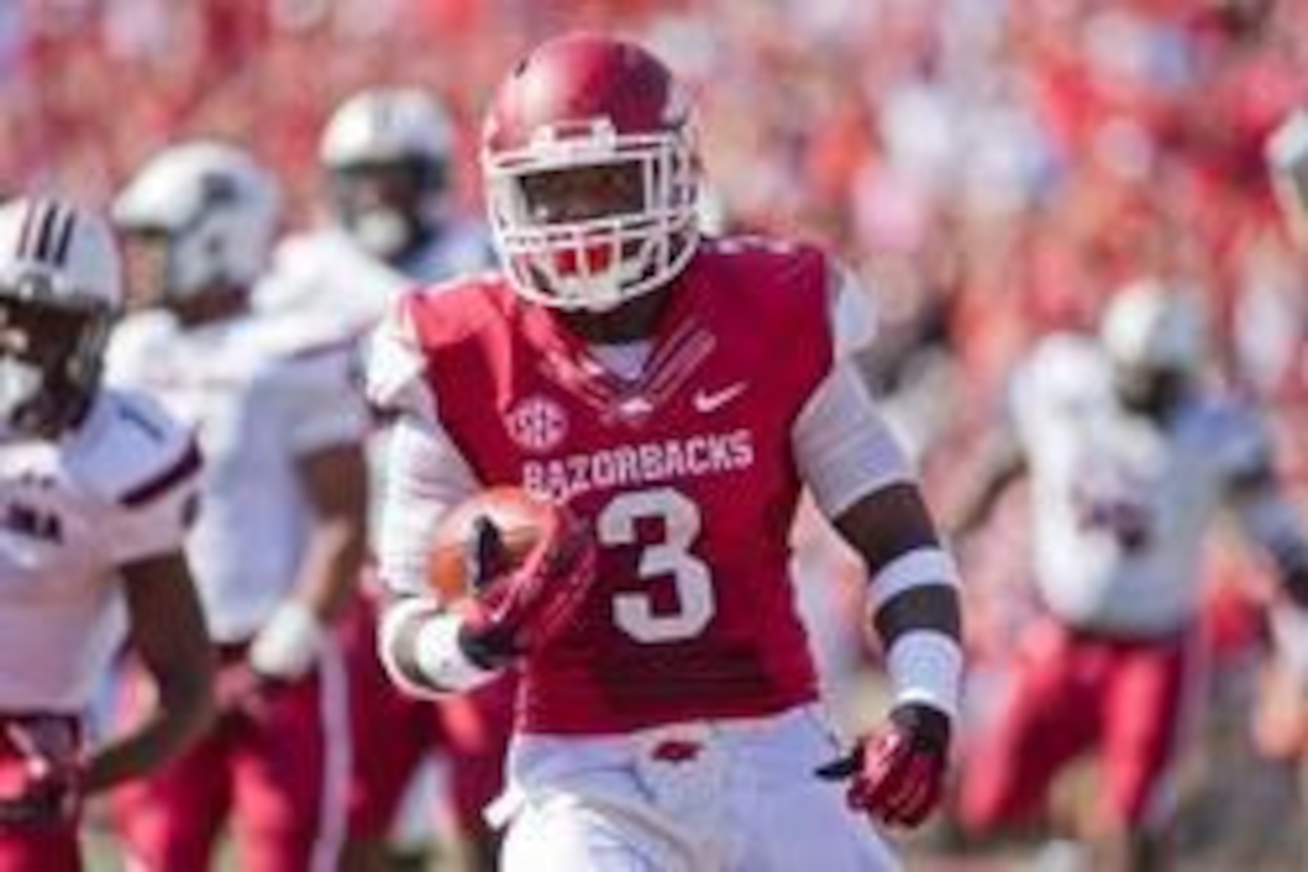 Oct 12, 2013; Fayetteville, AR, USA; Arkansas Razorbacks running back Alex Collins (3) runs with the ball during a game against the South Carolina Gamecocks at Donald W. Reynolds Razorback Stadium. South Carolina defeated Arkansas 52-7. Mandatory Credit: 