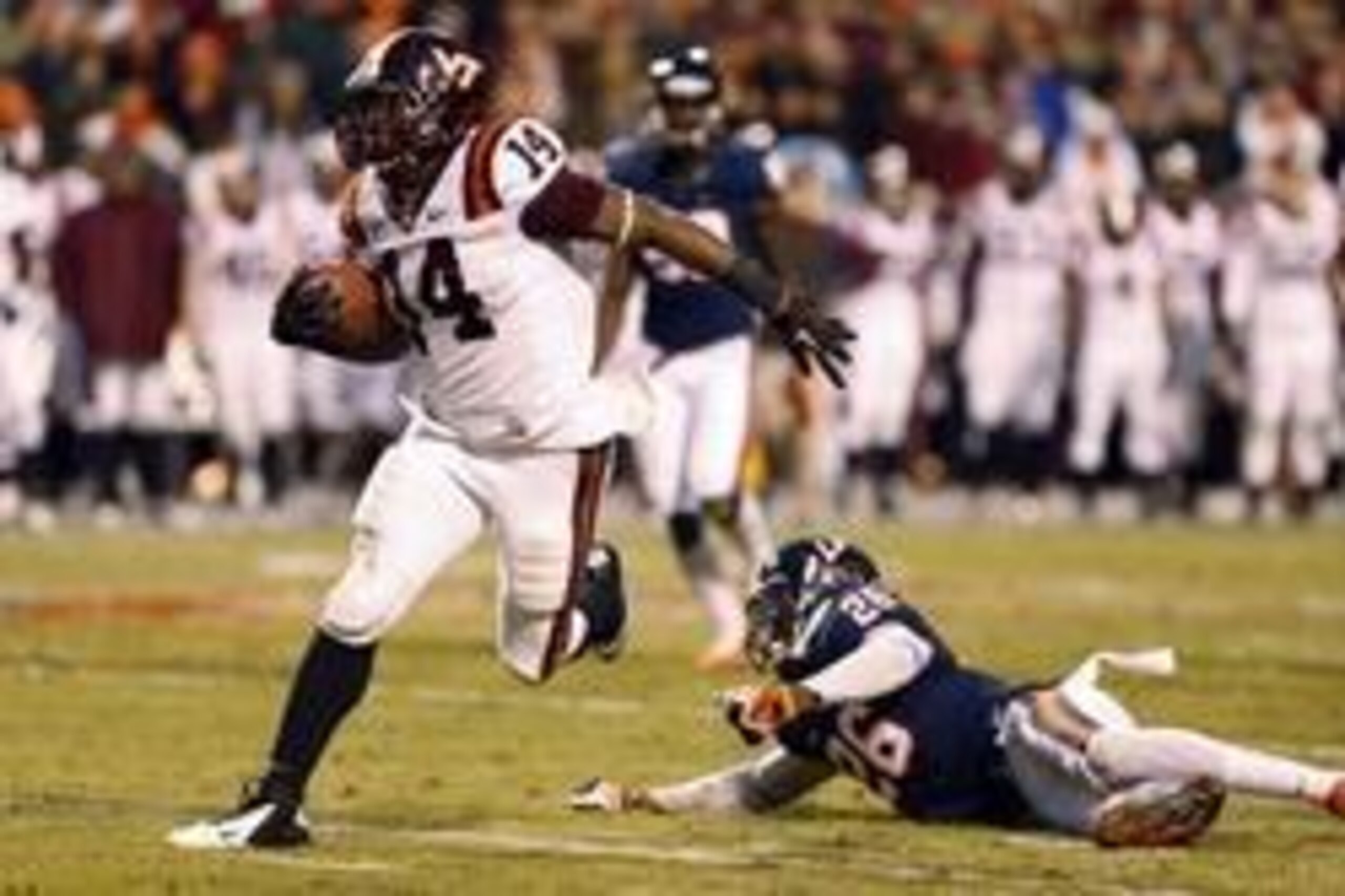 Nov 30, 2013; Charlottesville, VA, USA; Virginia Tech Hokies running back Trey Edmunds (14) carries the ball past Virginia Cavaliers cornerback Maurice Canady (26) to score a touchdown in the second quarter at Scott Stadium. The Hokies won 16-6. Mandatory