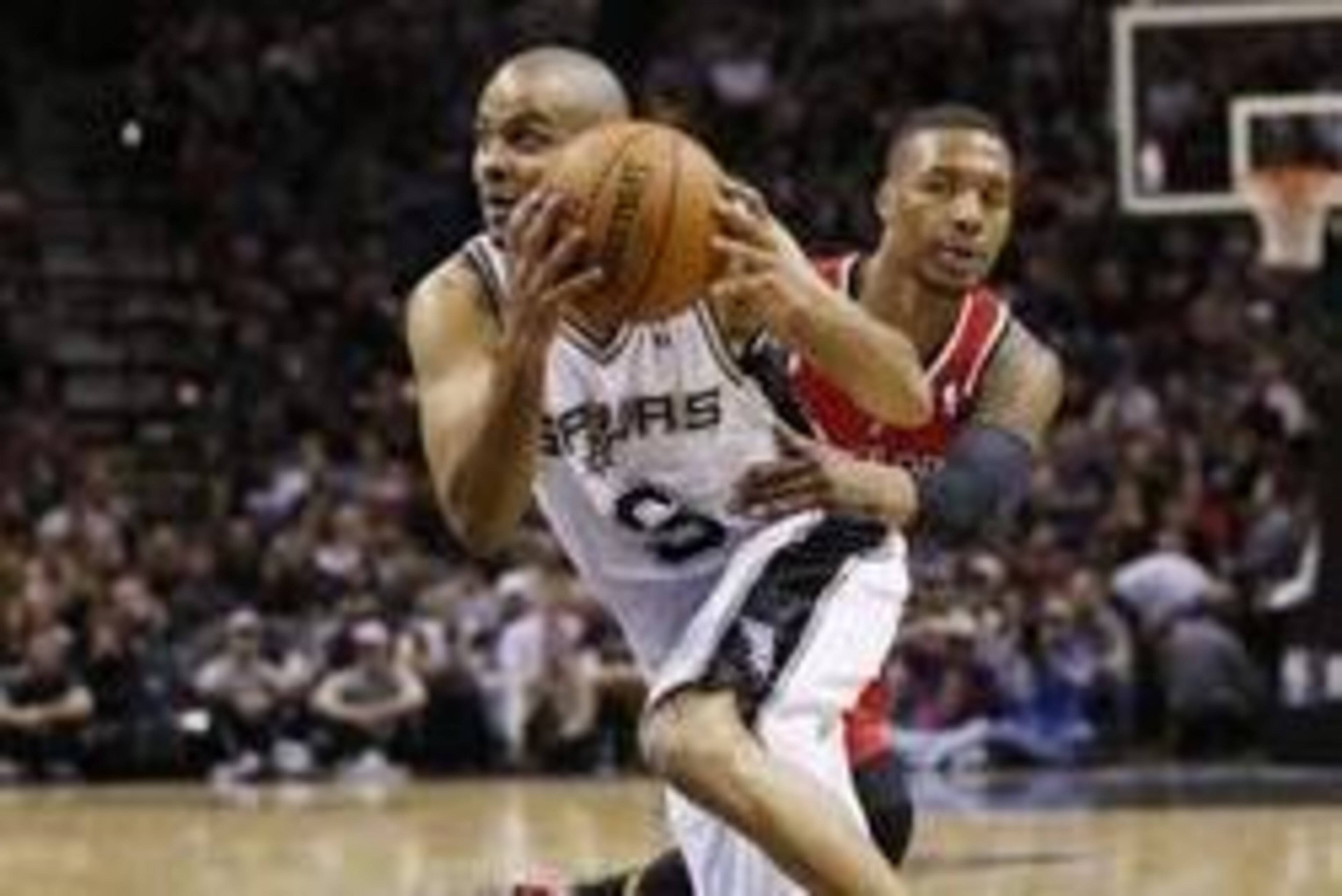 Mar 12, 2014; San Antonio, TX, USA; San Antonio Spurs guard Tony Parker (9) drives to the basket past Portland Trail Blazers guard Damian Lillard (behind) during the first half at AT&T Center. Mandatory Credit: Soobum Im-USA TODAY Sports Mar 12, 2014; San Antonio, TX, USA; San Antonio Spurs guard Tony Parker (9) drives to the basket past Portland Trail Blazers guard Damian Lillard (behind) during the first half at AT&T Center. Mandatory Credit: Soobum Im-USA TODAY Sports
