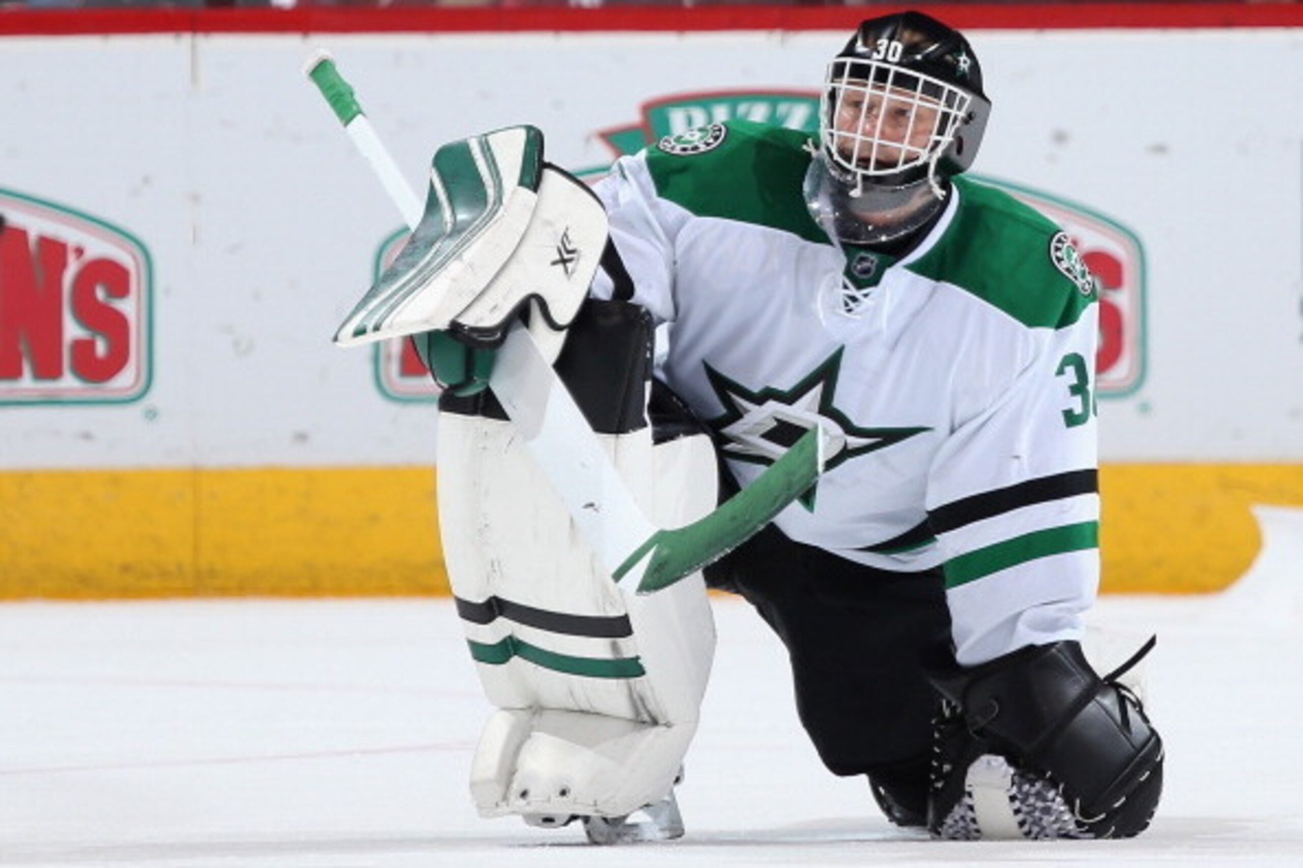 GLENDALE, AZ - APRIL 13:  Goaltender Tim Thomas #30 of the Dallas Stars during a break from the NHL game against the Phoenix Coyotes at Jobing.com Arena on April 13, 2014 in Glendale, Arizona. The Coyotes defeated the Stars 1-0.  (Photo by Christian Peter