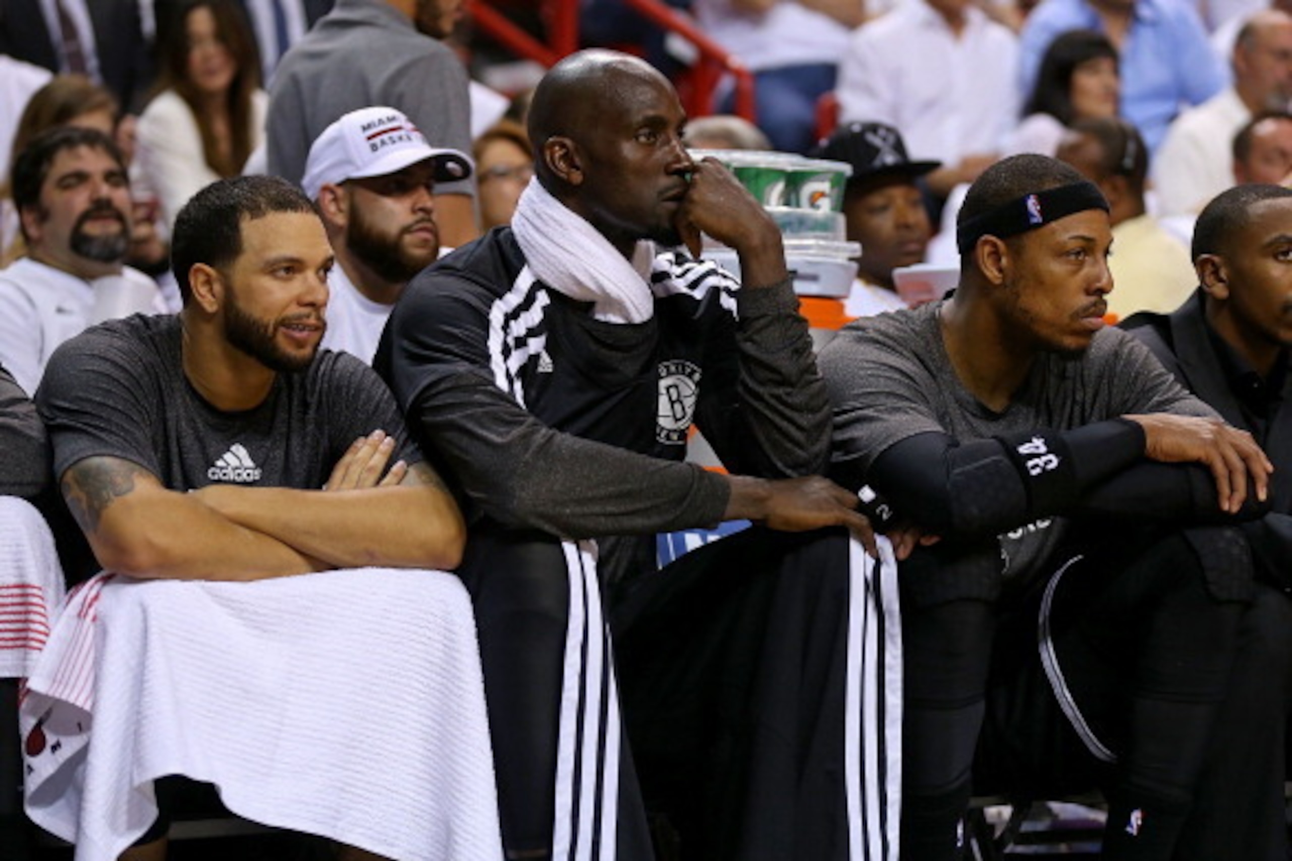 MIAMI, FL - MAY 06: Deron Williams #8, Kevin Garnett #2 and Paul Pierce #34 of the Brooklyn Nets look on during Game One of the Eastern Conference Semifinals of the 2014 NBA Playoffs against the Miami Heat at American Airlines Arena on May 6, 2014 in Miam
