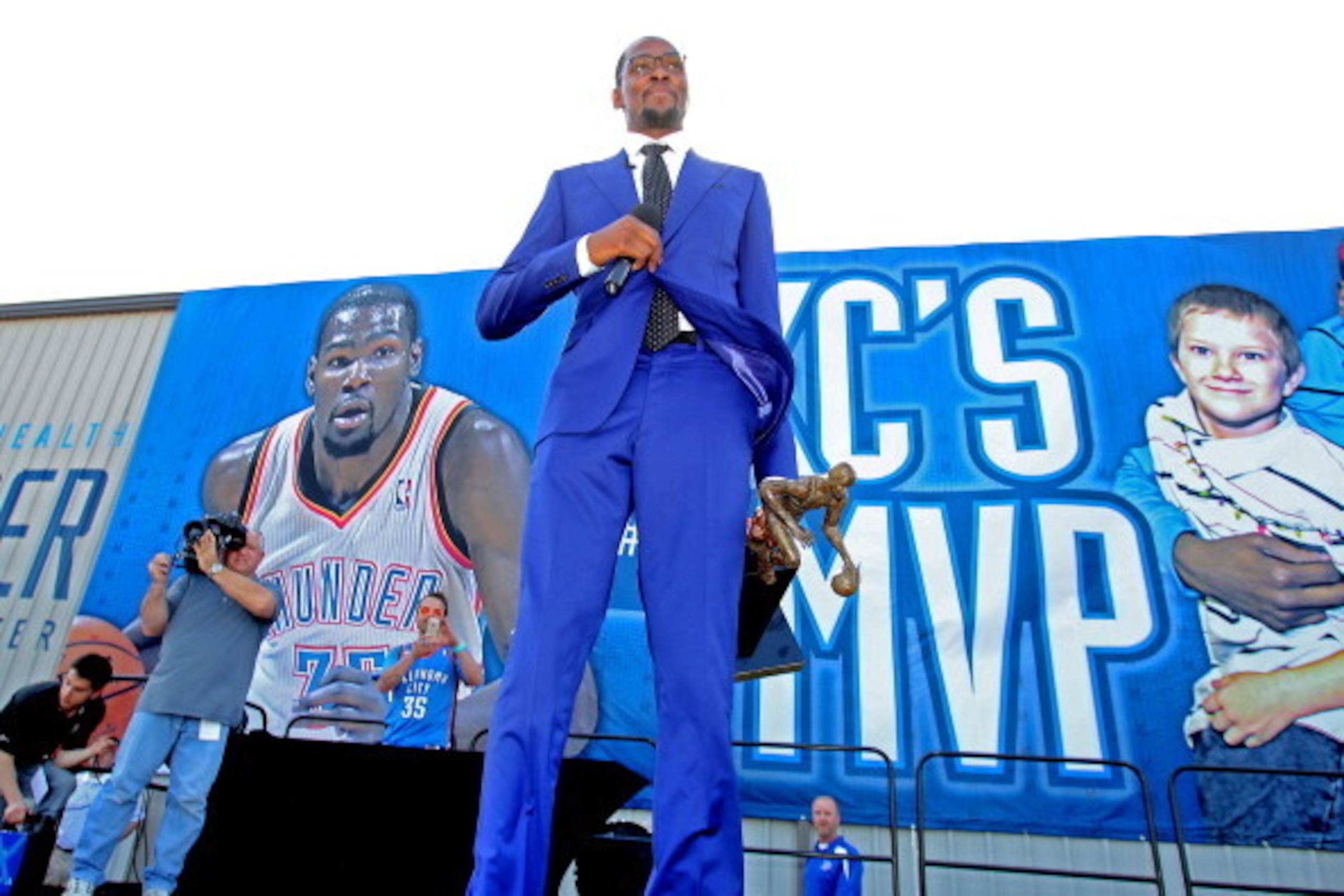 EDMOND, OK - MAY 06:  Kevin Durant of the Oklahoma City Thunder addresses the fans with the Maurice Podoloff Trophy at the 2013-14 KIA Player of the Year award announcement on May 6, 2014 at the Thunder Events Center in Edmond, Oklahoma. NOTE TO USER: Use