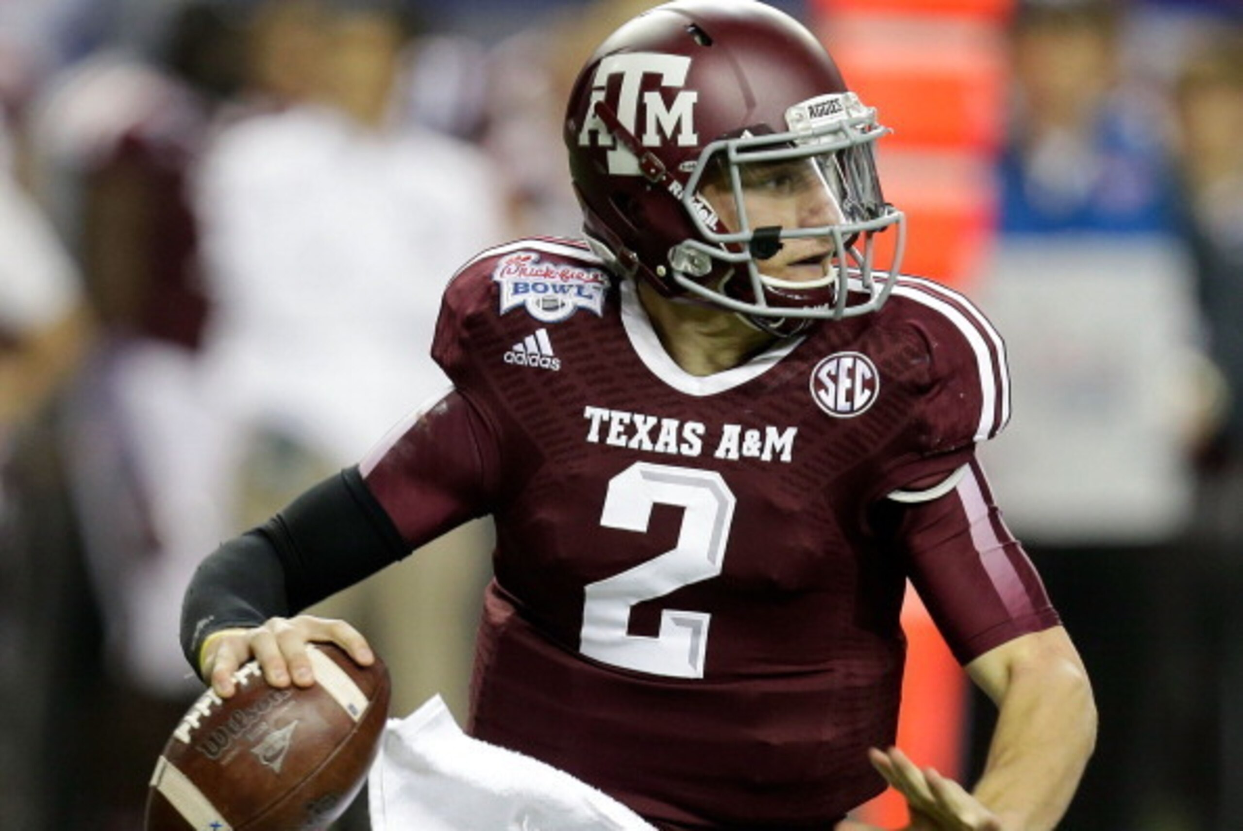 ATLANTA, GA - DECEMBER 31:  Quarterback Johnny Manziel #2 of the Texas A&M Aggies rolls out and looks downfield to pass during the the Chick-fil-A Bowl game against the Duke Blue Devils at the Georgia Dome on December 31, 2013 in Atlanta, Georgia.  (Photo
