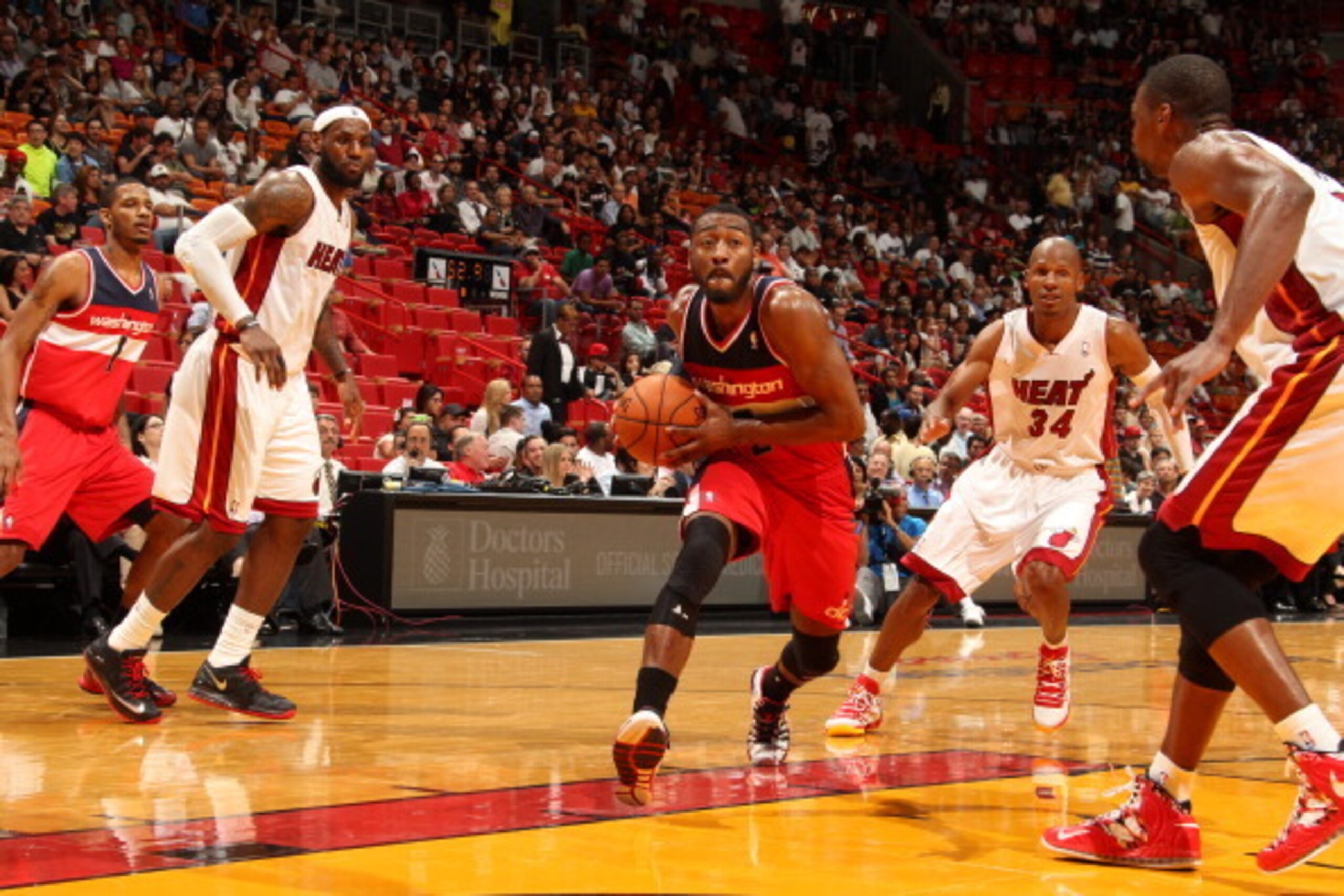 MIAMI, FL - March 10: John Wall #2 of the Washington Wizards goes up for the layup against the Miami Heat at the American Airlines Arena in Miami, Florida on March 10 2014. NOTE TO USER: User expressly acknowledges and agrees that, by downloading and/or u