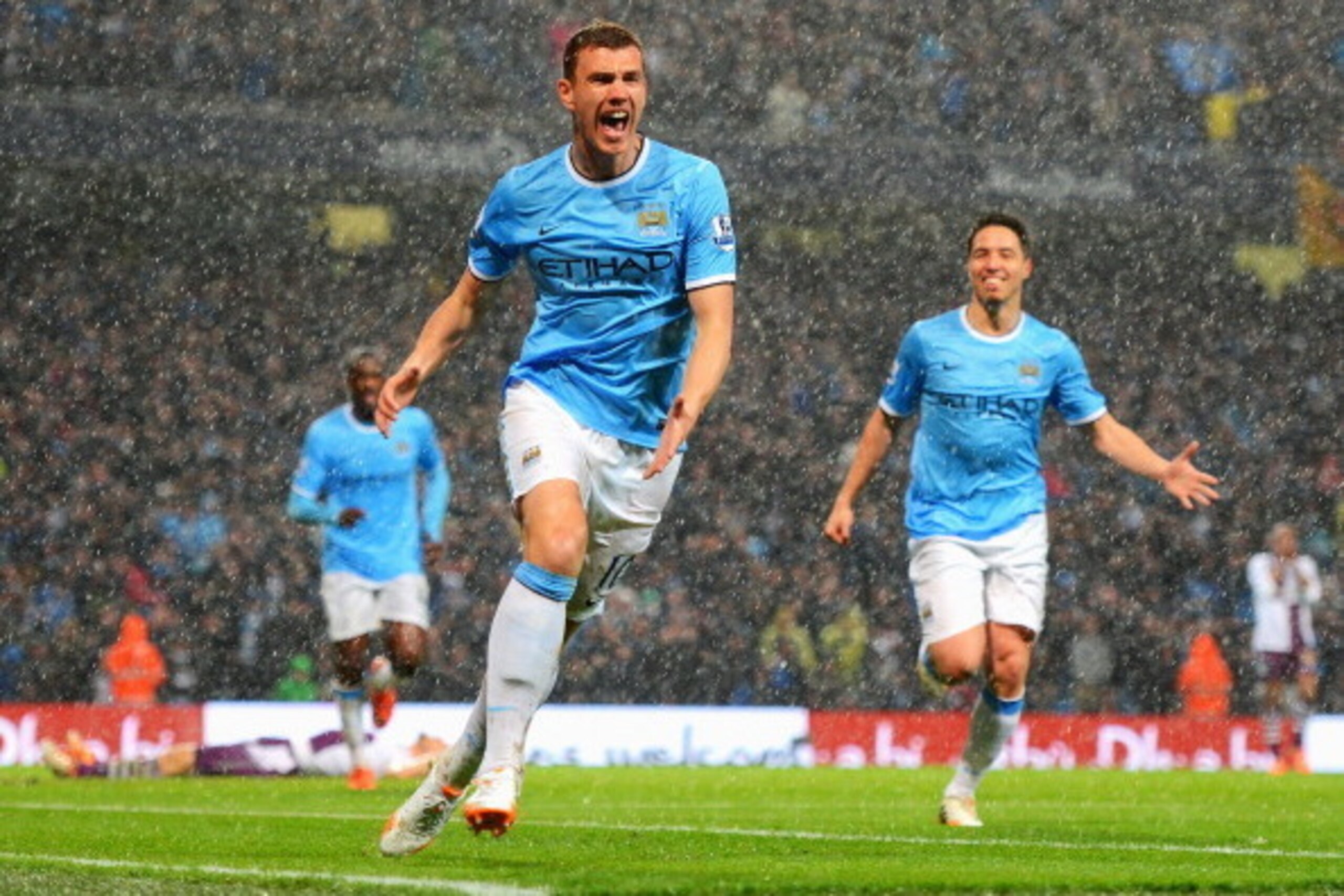 MANCHESTER, ENGLAND - MAY 07:  Edin Dzeko of Manchester City celebrates scoring the opening goal during the Barclays Premier League match between Manchester City and Aston Villa at Etihad Stadium on May 7, 2014 in Manchester, England.  (Photo by Michael R