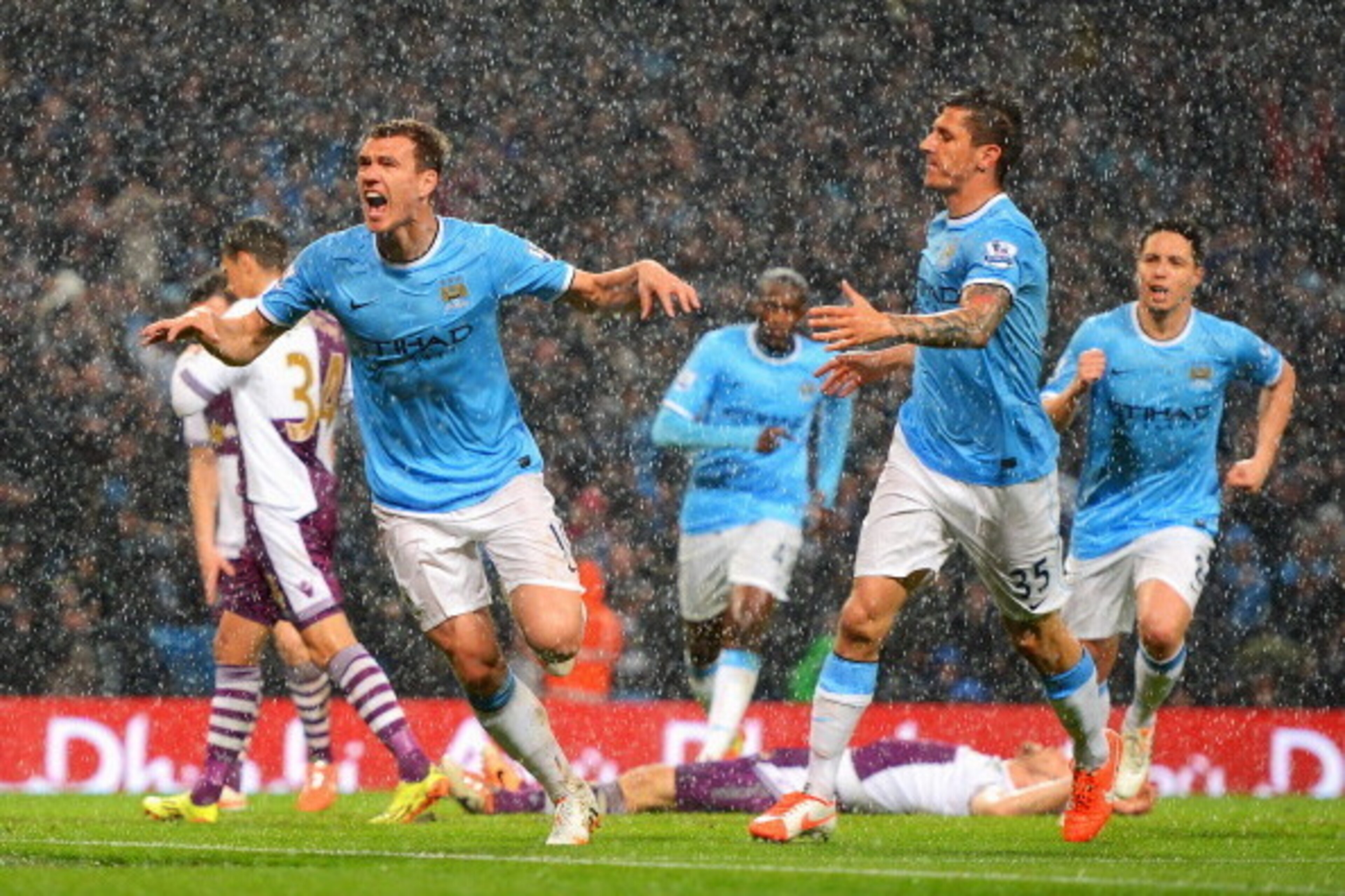 MANCHESTER, ENGLAND - MAY 07: Edin Dzeko of Manchester City celebrates scoring the opening goal during the Barclays Premier League match between Manchester City and Aston Villa at Etihad Stadium on May 7, 2014 in Manchester, England. (Photo by Michael R MANCHESTER, ENGLAND - MAY 07: Edin Dzeko of Manchester City celebrates scoring the opening goal during the Barclays Premier League match between Manchester City and Aston Villa at Etihad Stadium on May 7, 2014 in Manchester, England. (Photo by Michael R