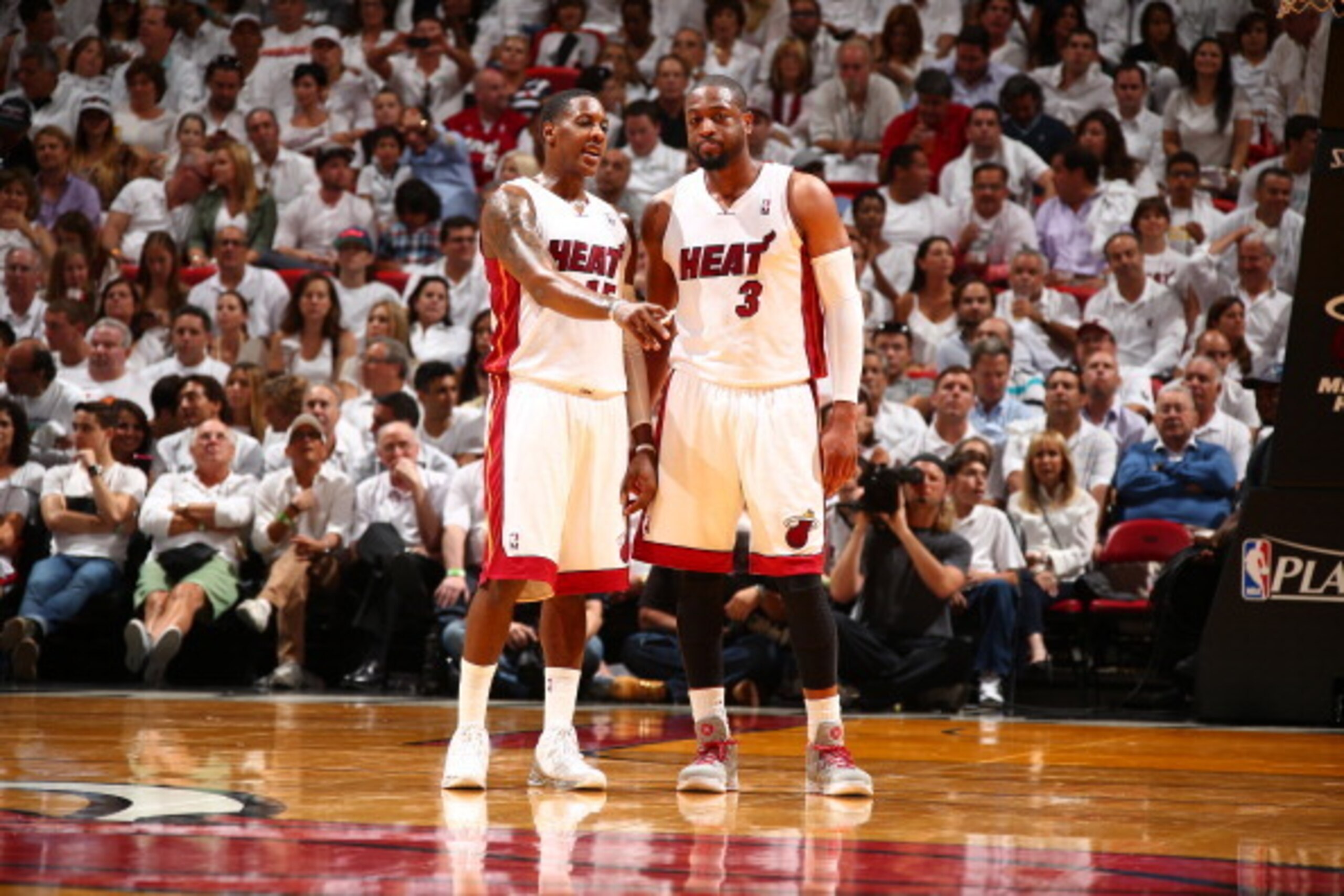 MIAMI, FL - MAY 6: Mario Chalmers #15 and Dwyane Wade #3 of the Miami Heat look on against the Brooklyn Nets in Game One of the Eastern Conference Semifinals of the 2014 NBA playoffs at American Airlines Arena in Miami, Florida on May 6, 2014.  NOTE TO US