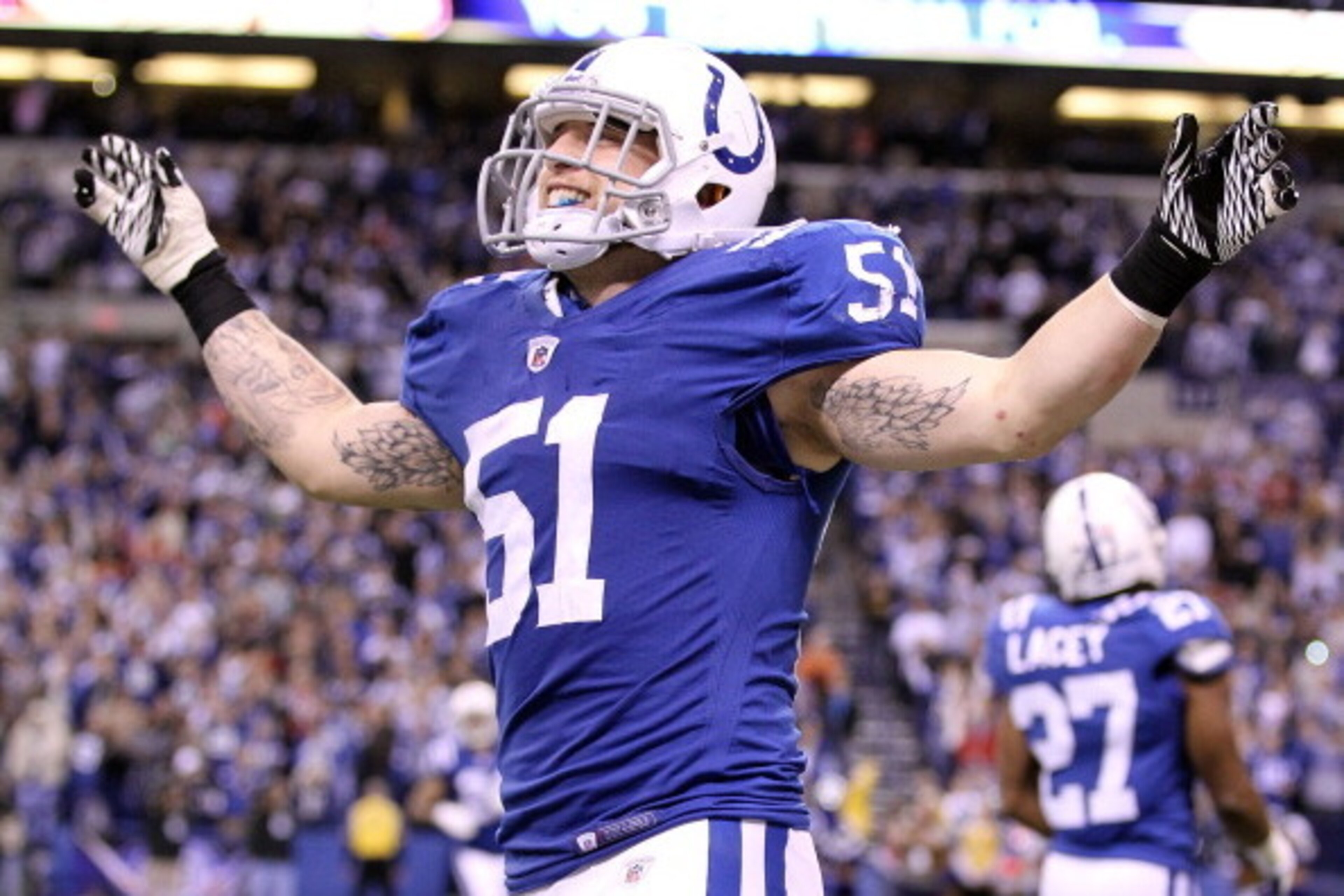 INDIANAPOLIS, IN - DECEMBER 22:  Pat Angerer #51 of the Indianapolis Colts celebrates after the final play of the Colts 19-16 victory over the Houston Texans in the NFL at Lucas Oil Stadium on December 22, 2011 in Indianapolis, Indiana.  (Photo by Andy Ly