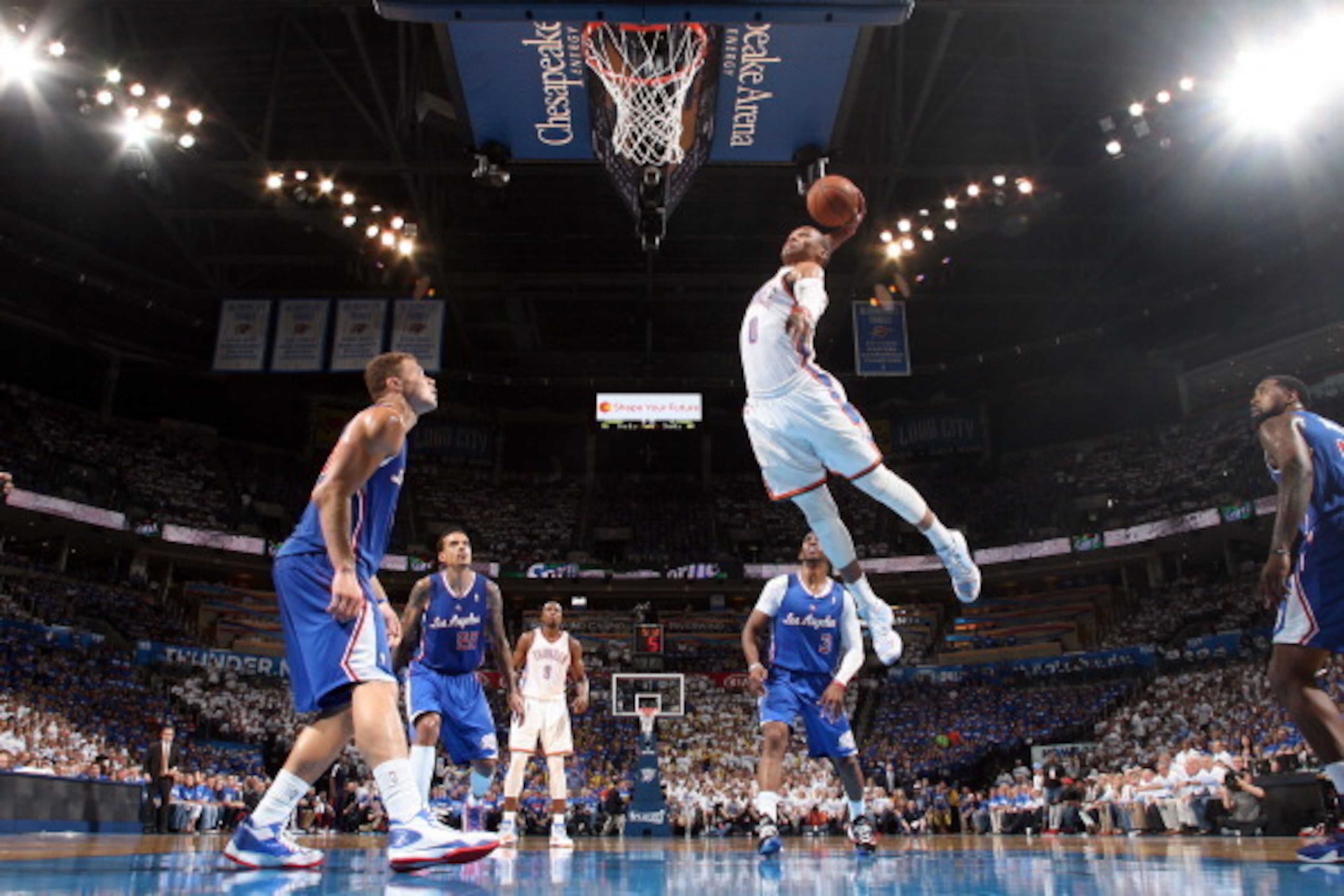 OKLAHOMA CITY, OK - MAY 7: Russell Westbrook #0 of the Oklahoma City Thunder goes up for a dunk against the Los Angeles Clippers in Game Two of the Western Conference Semifinals during the 2014 NBA Playoffs on May 7, 2014 at the Chesapeake Energy Arena in