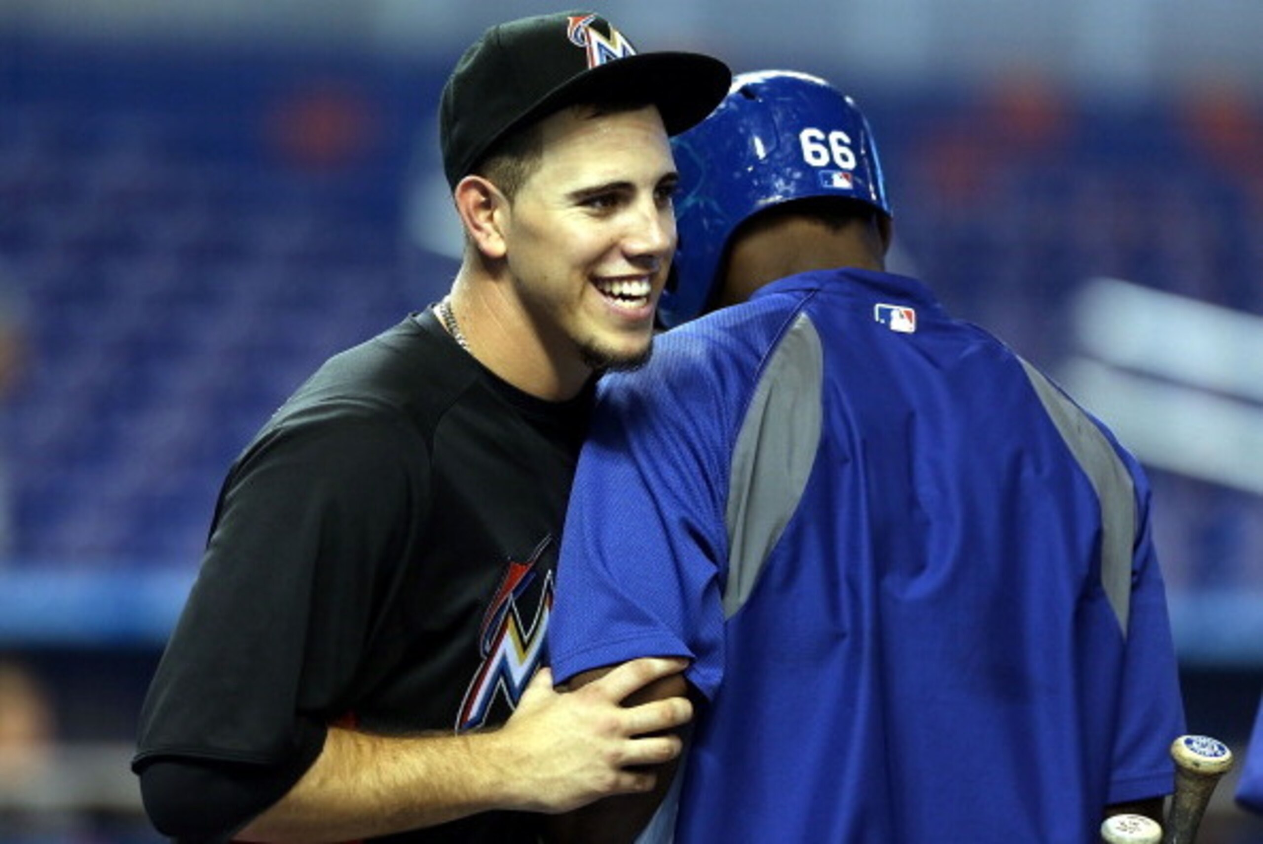 MIAMI, FL - AUGUST 21:  Yasiel Puig #66 (R) of the Los Angeles Dodgers bumps into Pitcher Jose Fernandez #16 of the Miami Marlins during batting at Marlins Park on August 21, 2013 in Miami, Florida.  (Photo by Marc Serota/Getty Images)