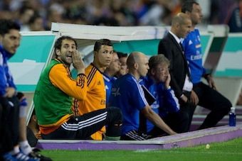 VALLADOLID, SPAIN - MAY 07: Goalkeeper Diego Lopez (L) of Real Madrid CF and his team-mate Cristiano Ronaldo (R) watch the acton from the bench during the second half of the La Liga match between Real Valladolid CF and Real Madrid CF at Estadio Jose Zoril