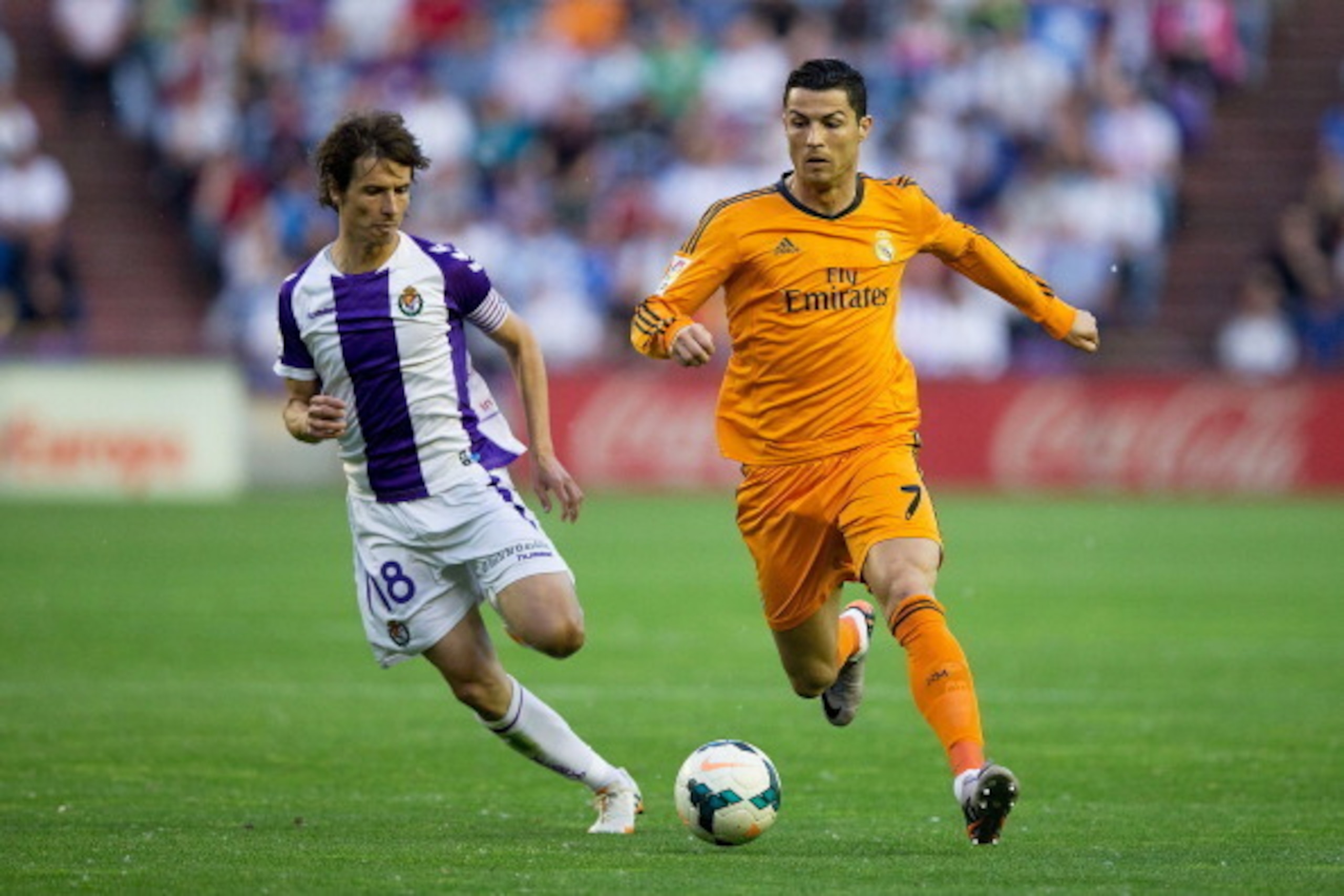 VALLADOLID, SPAIN - MAY 07: Cristiano Ronaldo (R) of Real Madrid CF competes for the ball with Alvaro Rubio (L) of Real Valladolid CF during the La Liga match between Real Valladolid CF and Real Madrid CF at Estadio Jose Zorilla on May 7, 2014 in Valladol