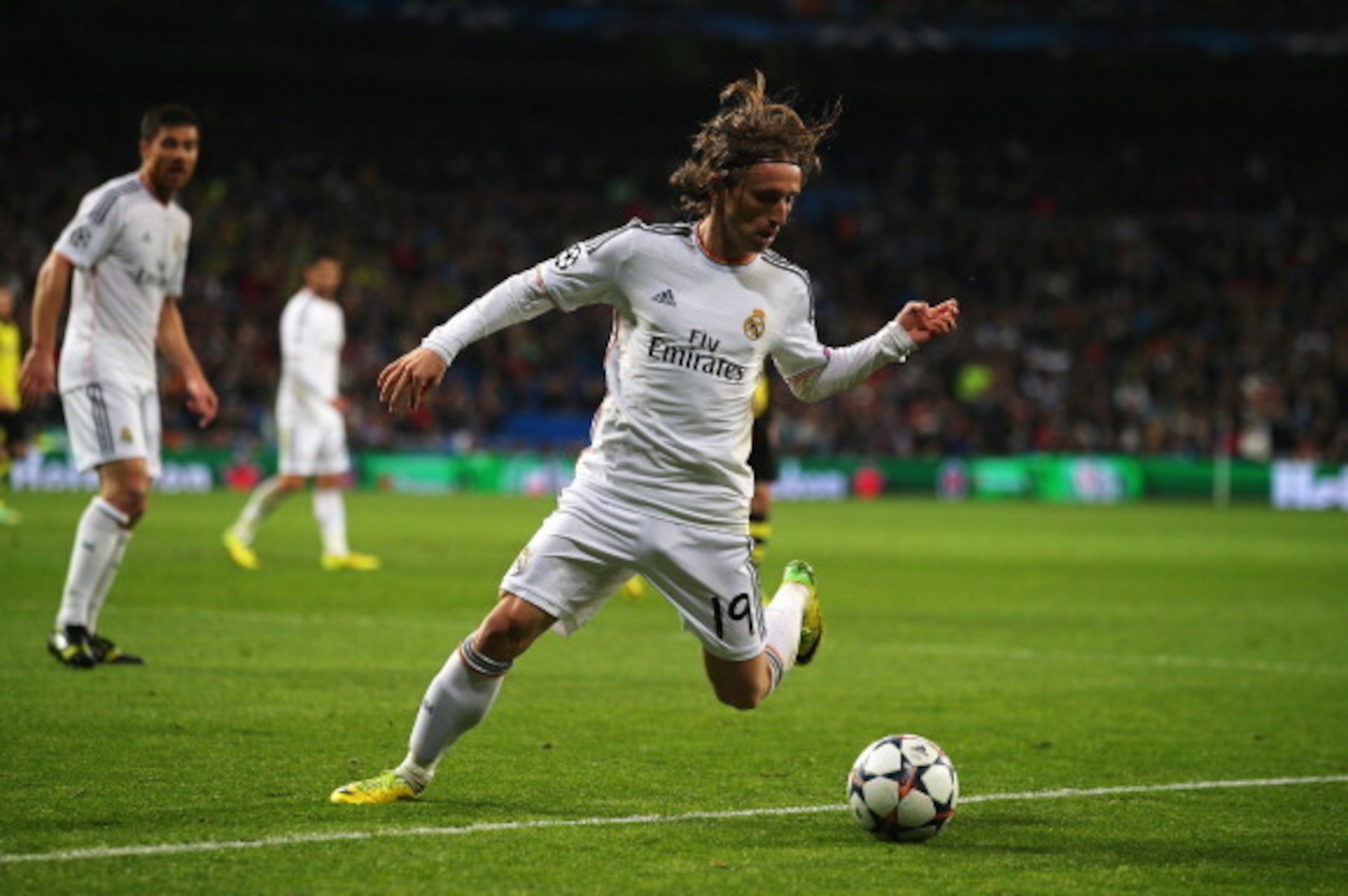 MADRID, SPAIN - APRIL 02: Luka Modric of Real Madrid in action during the UEFA Champions League Quarter Final first leg match between Real Madrid and Borussia Dortmund at Estadio Santiago Bernabeu on April 2, 2014 in Madrid, Spain. (Photo by Clive Rose/G MADRID, SPAIN - APRIL 02: Luka Modric of Real Madrid in action during the UEFA Champions League Quarter Final first leg match between Real Madrid and Borussia Dortmund at Estadio Santiago Bernabeu on April 2, 2014 in Madrid, Spain. (Photo by Clive Rose/G