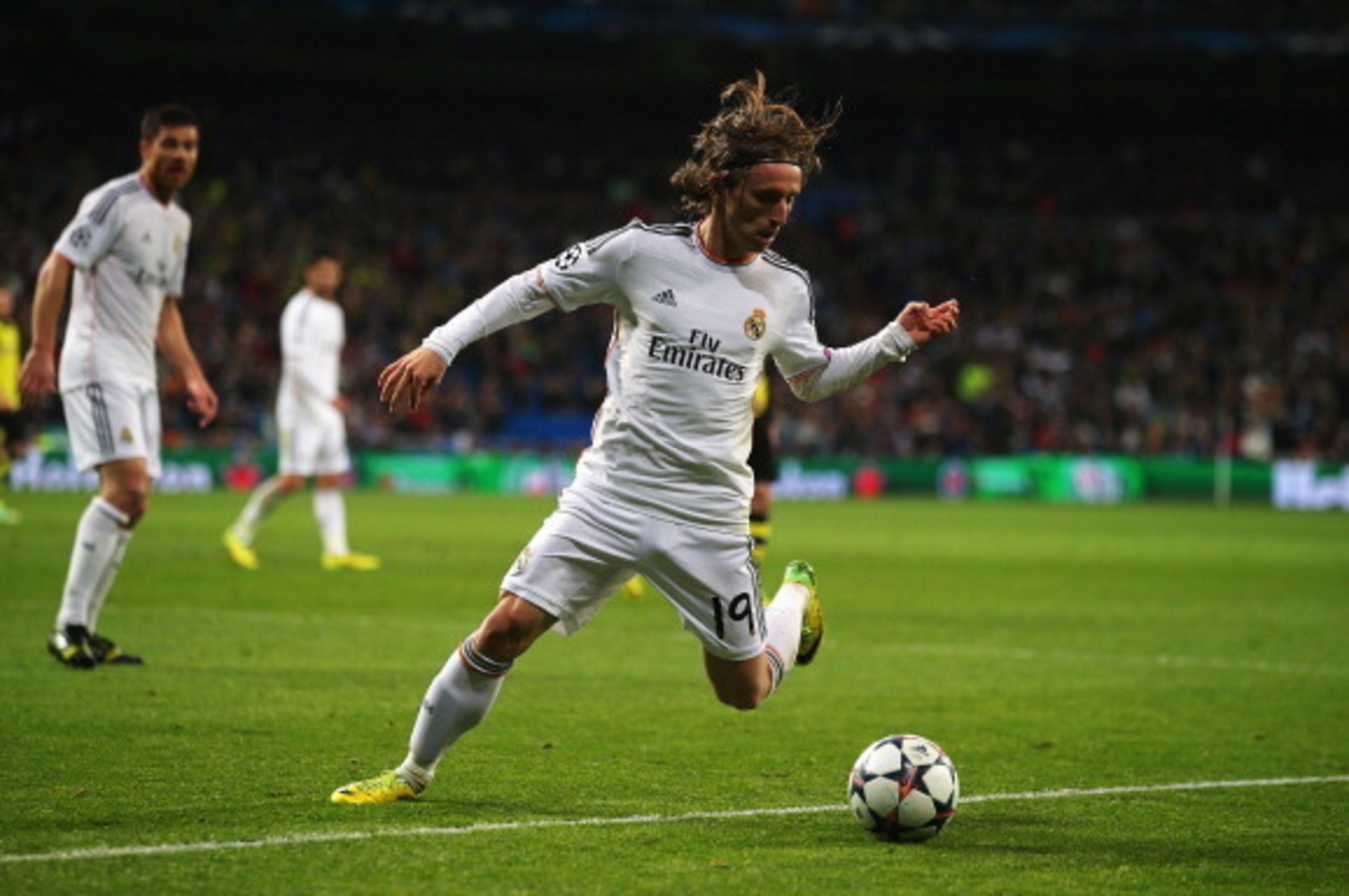 MADRID, SPAIN - APRIL 02: Luka Modric of Real Madrid in action during the UEFA Champions League Quarter Final first leg match between Real Madrid and Borussia Dortmund at Estadio Santiago Bernabeu on April 2, 2014 in Madrid, Spain.  (Photo by Clive Rose/G