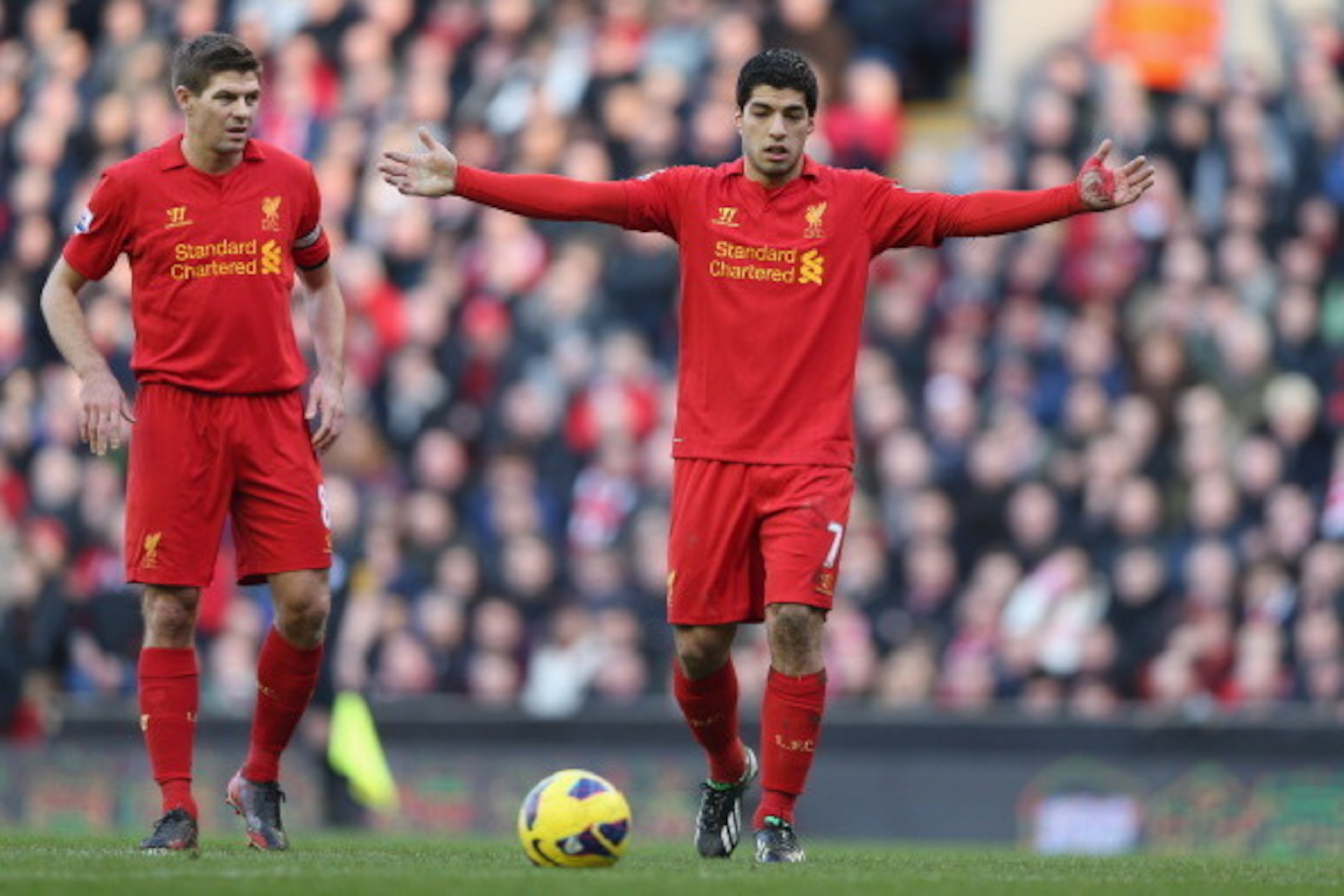 LIVERPOOL, ENGLAND - FEBRUARY 17:  Luis Suarez of Liverpool with Steven Gerrard of Liverpool  during the Barclays Premier League match between Liverpool and Swansea City at Anfield on February 17, 2013 in Liverpool, England.  (Photo by Clive Brunskill/Get