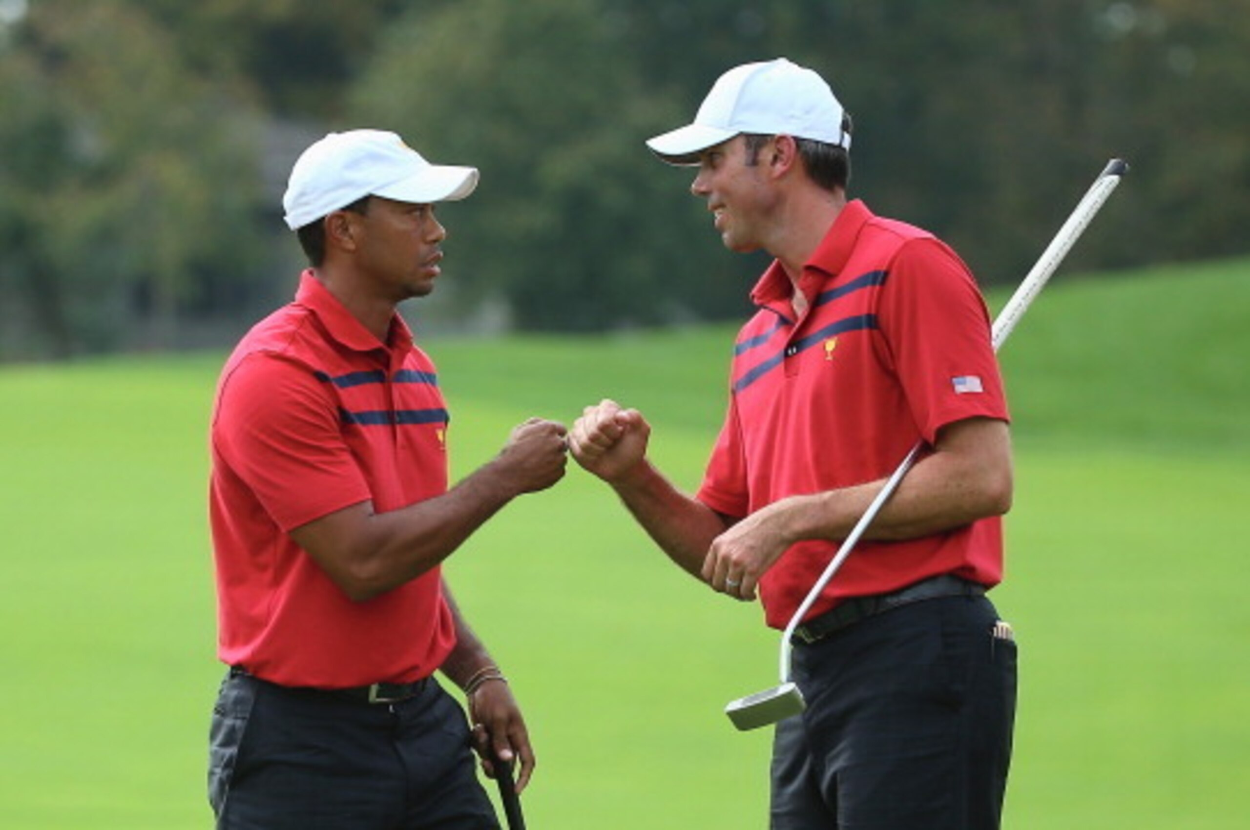 DUBLIN, OH - OCTOBER 05:  Tiger Woods and Matt Kuchar of the U.S. Team celebrates after a birdie putt on the 13th hole during the Day Three Four-ball Matches at the Muirfield Village Golf Club on October 5, 2013  in Dublin, Ohio.  (Photo by Andy Lyons/Get