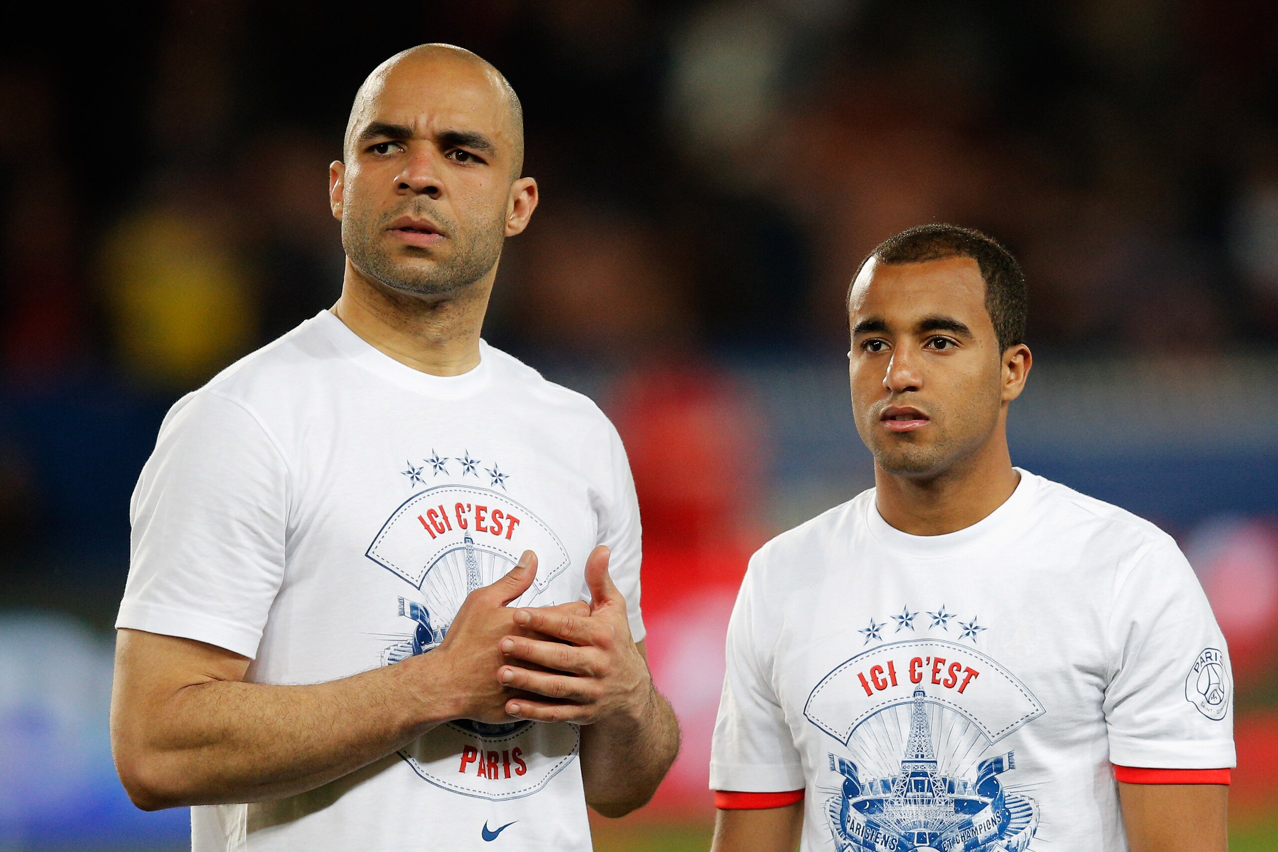 PARIS, FRANCE - MAY 07:  Alex (L) and Lucas Moura of PSG look on after the Ligue 1 match between Paris Saint-Germain FC and Stade Rennais FC at Parc des Princes on May 7, 2014 in Paris, France.  PSG lost the match 1-2 but still won the 2014 Ligue 1 Champi