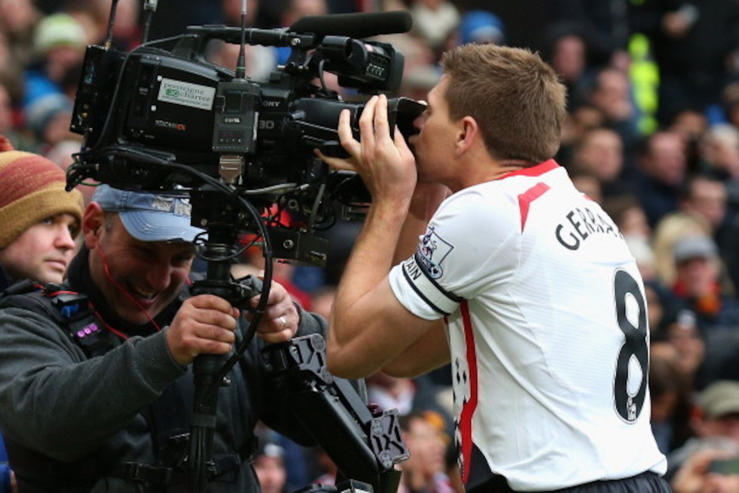 MANCHESTER, ENGLAND - MARCH 16:  Steven Gerrard of Liverpool celebrates scoring the second goal by kissing the steadicam during the Barclays Premier League match between Manchester United and Liverpool at Old Trafford on March 16, 2014 in Manchester, Engl